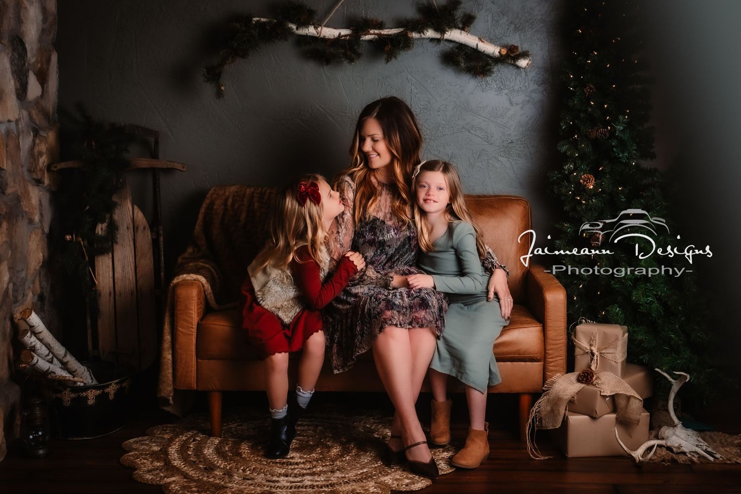 Cozy holiday family portrait by a Christmas tree in a rustic living room setting.