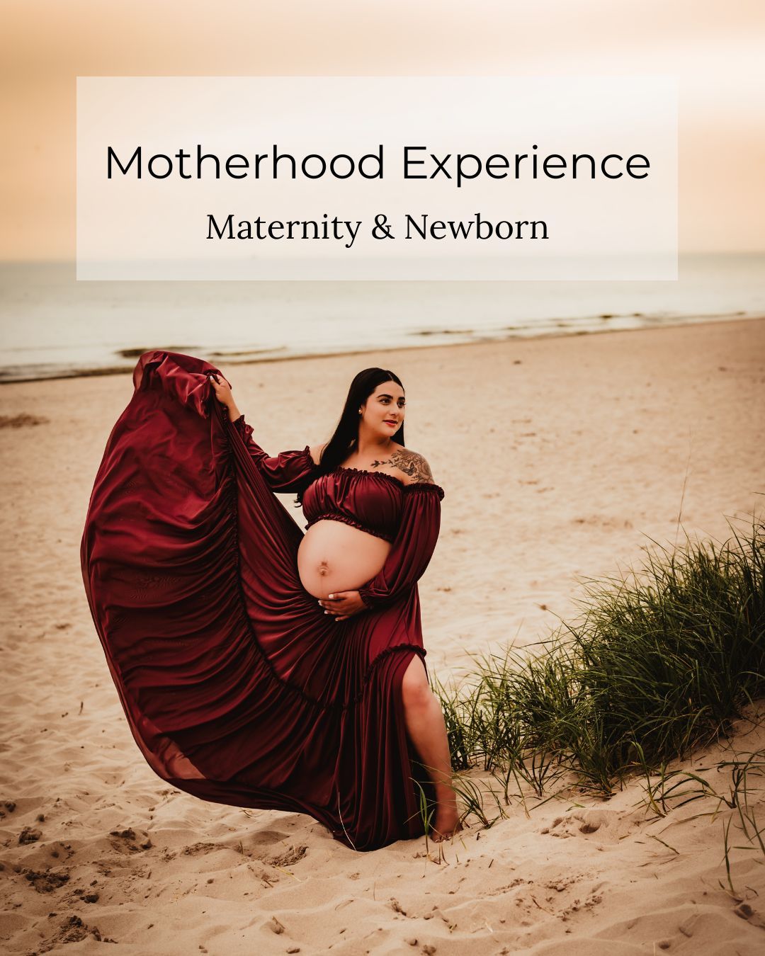 Pregnant woman in flowing burgundy gown on beach at sunset, maternity and newborn photography experience.