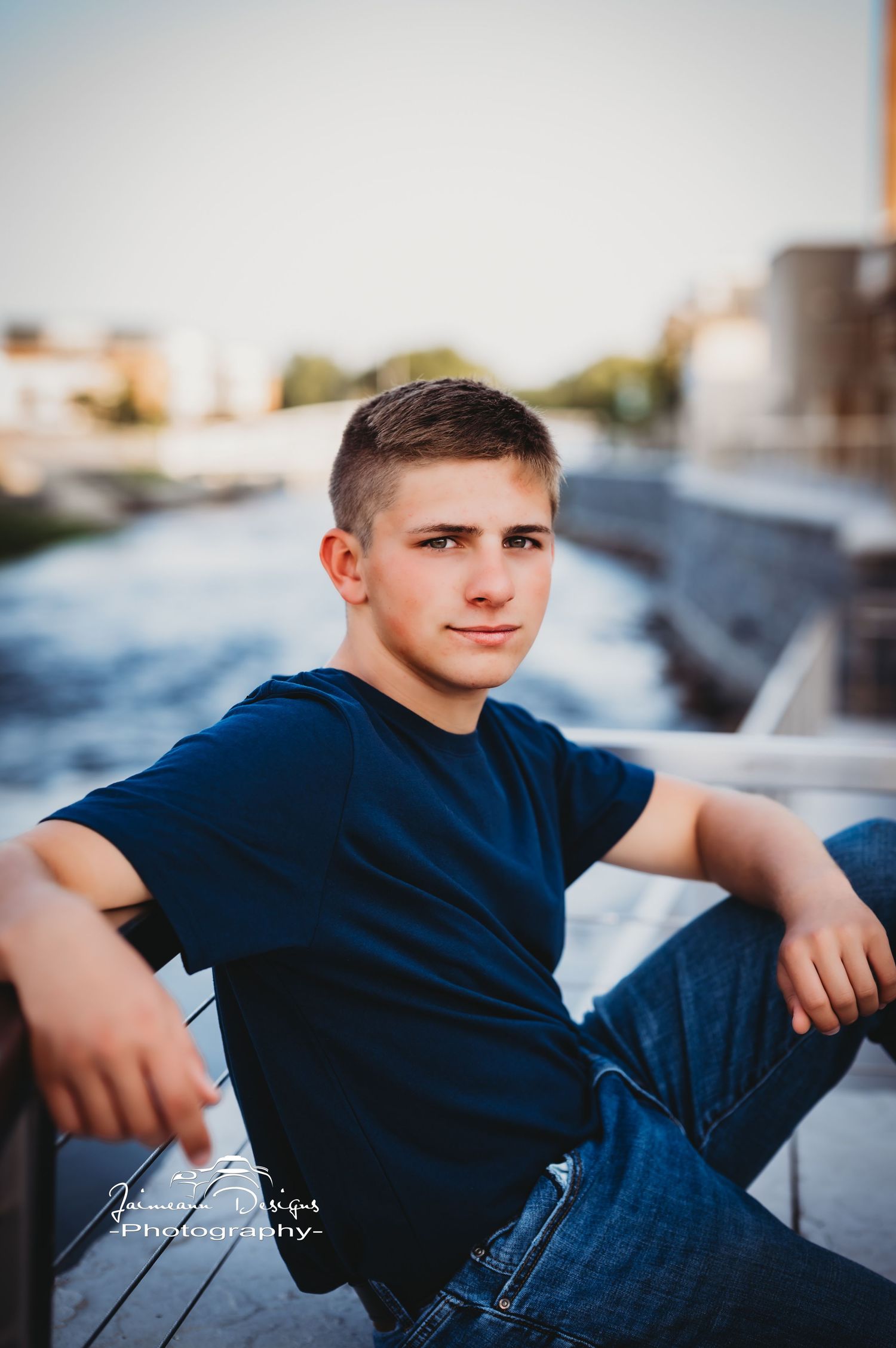 Outdoor portrait session on an urban rooftop at sunset.
