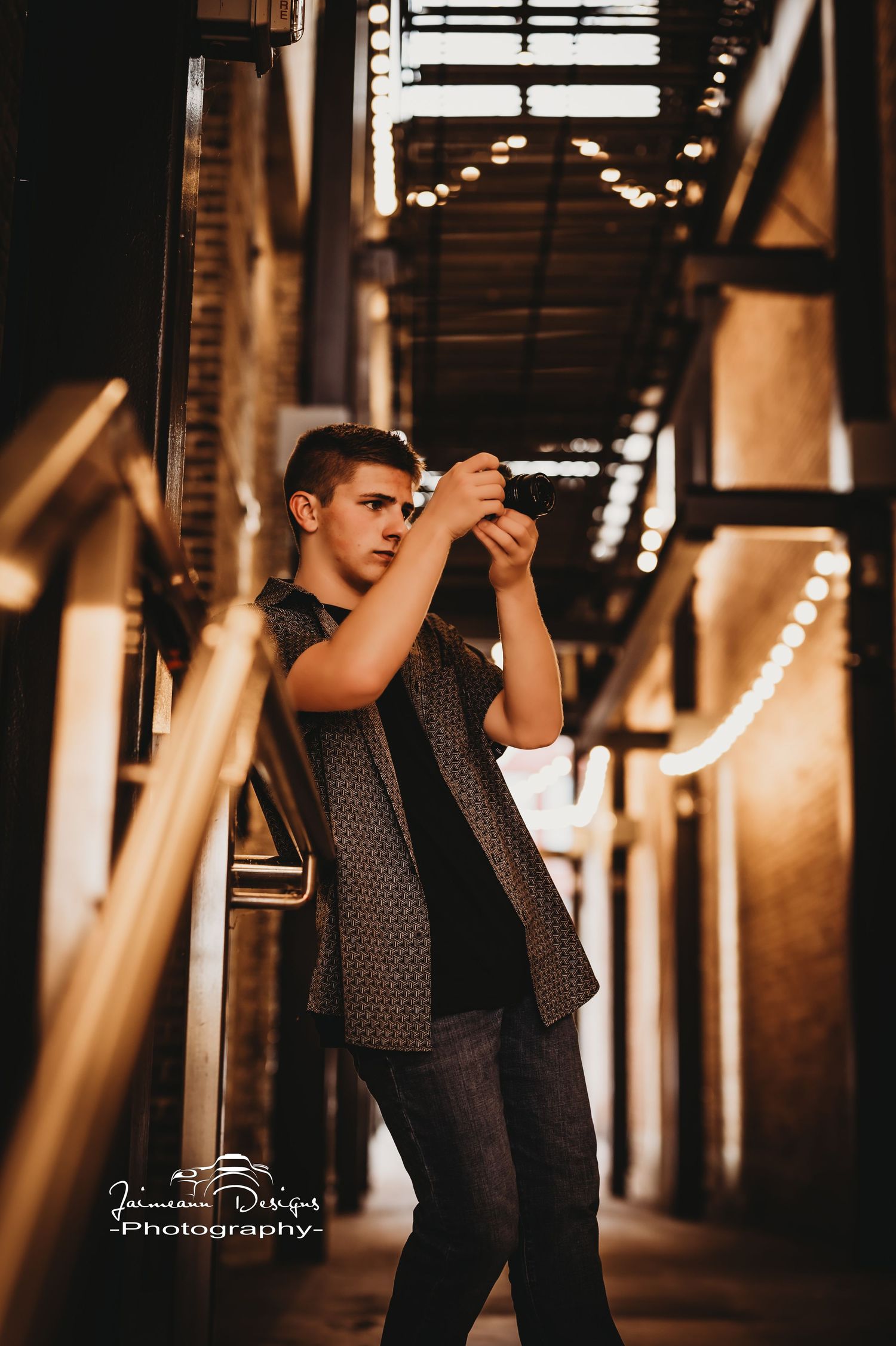 Creative portrait with string lights in industrial setting.