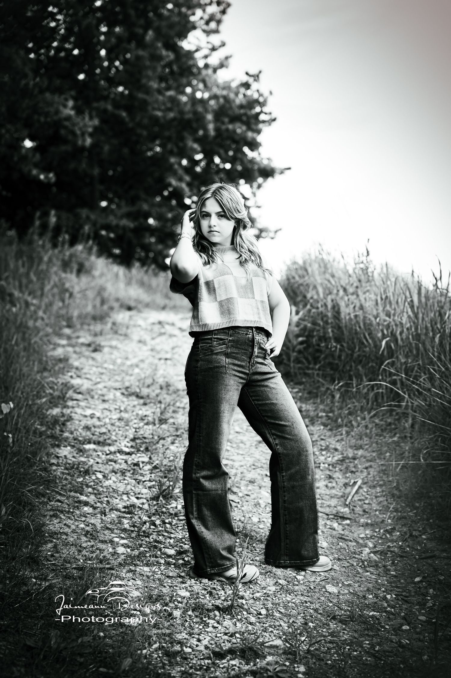 Black and white portrait on nature trail in retro-style denim.