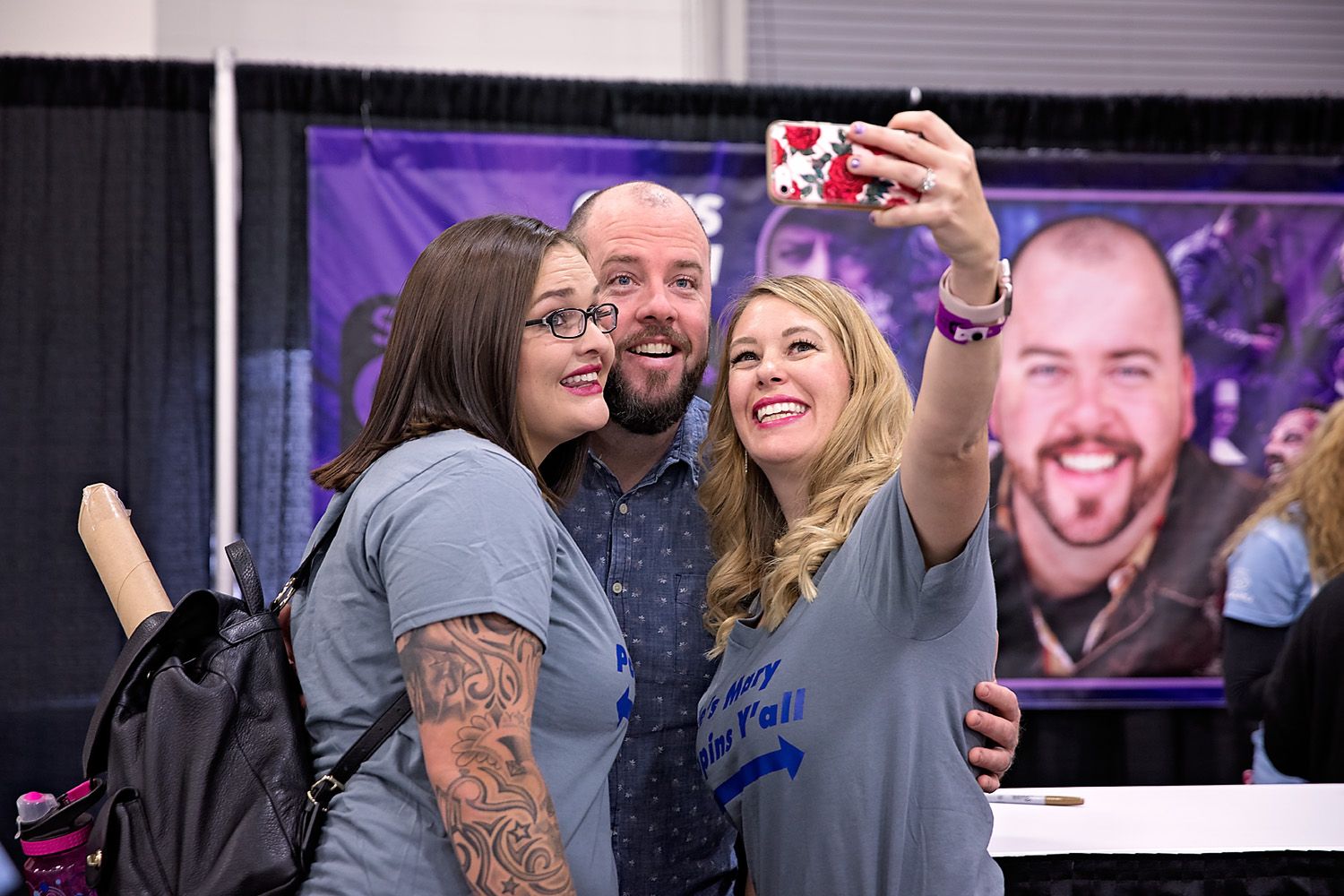 FanX attendees taking selfie with celebrity guest