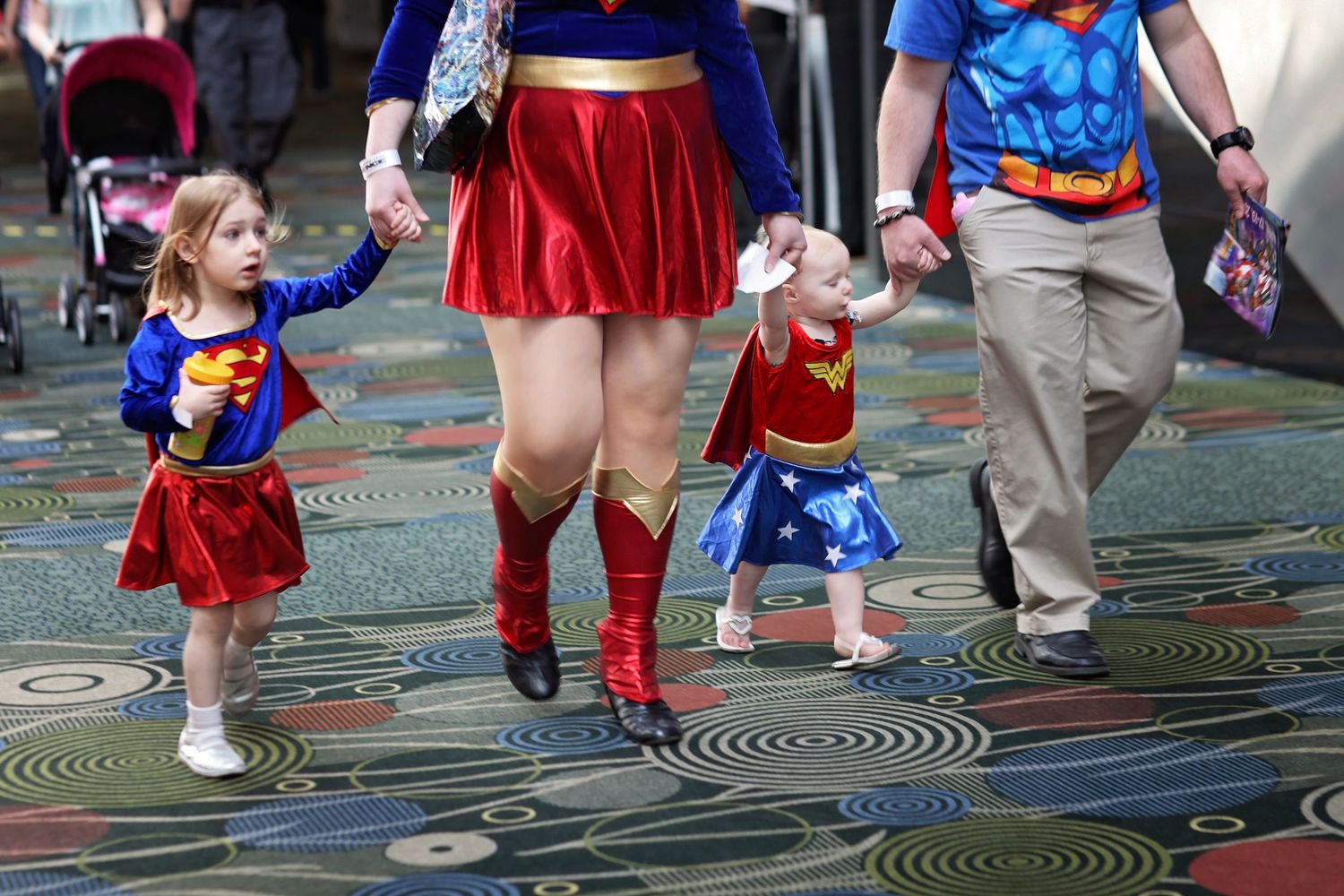 Family cosplaying as superheroes at FanX convention