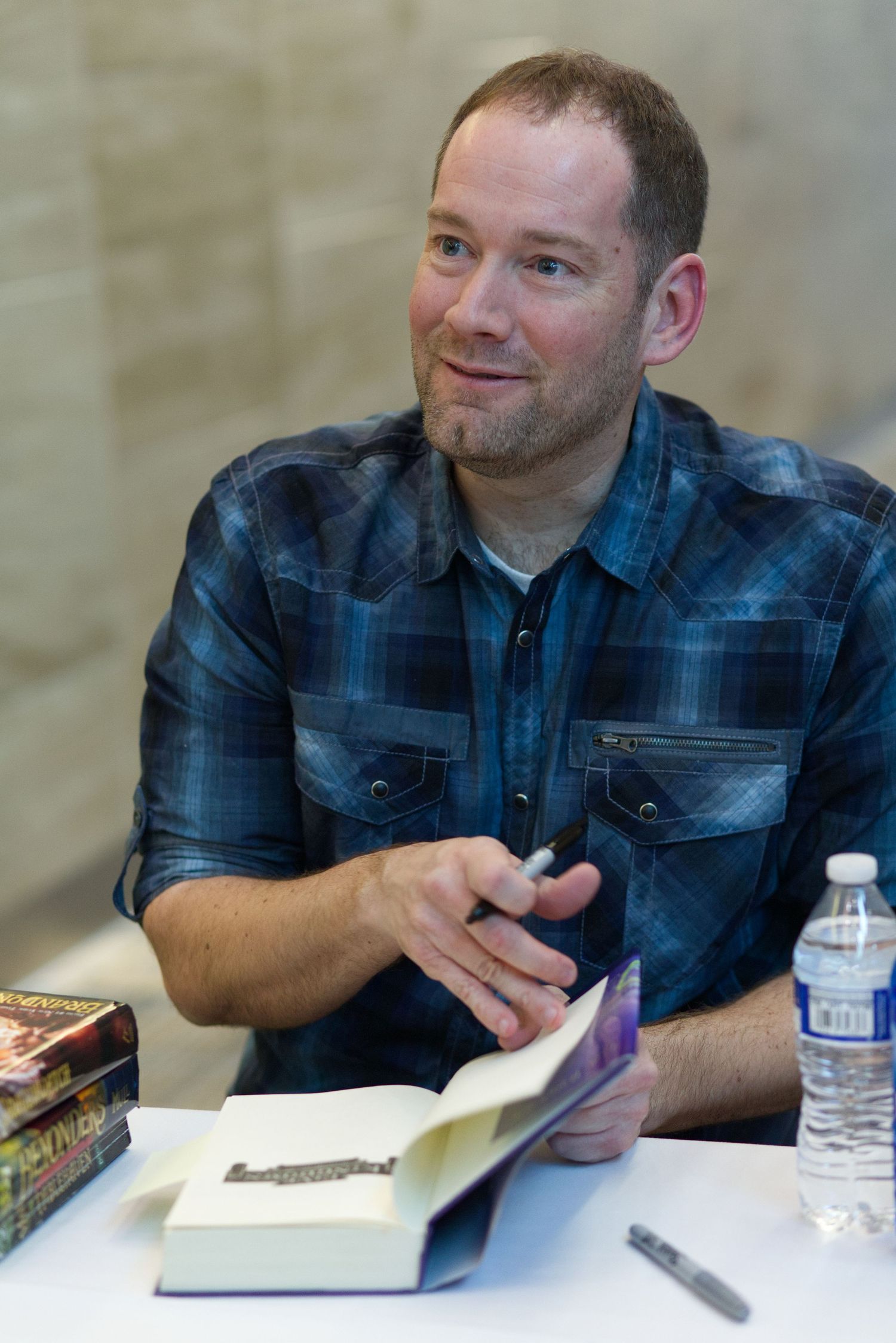Brandon Mull at StoryCon book signing.
