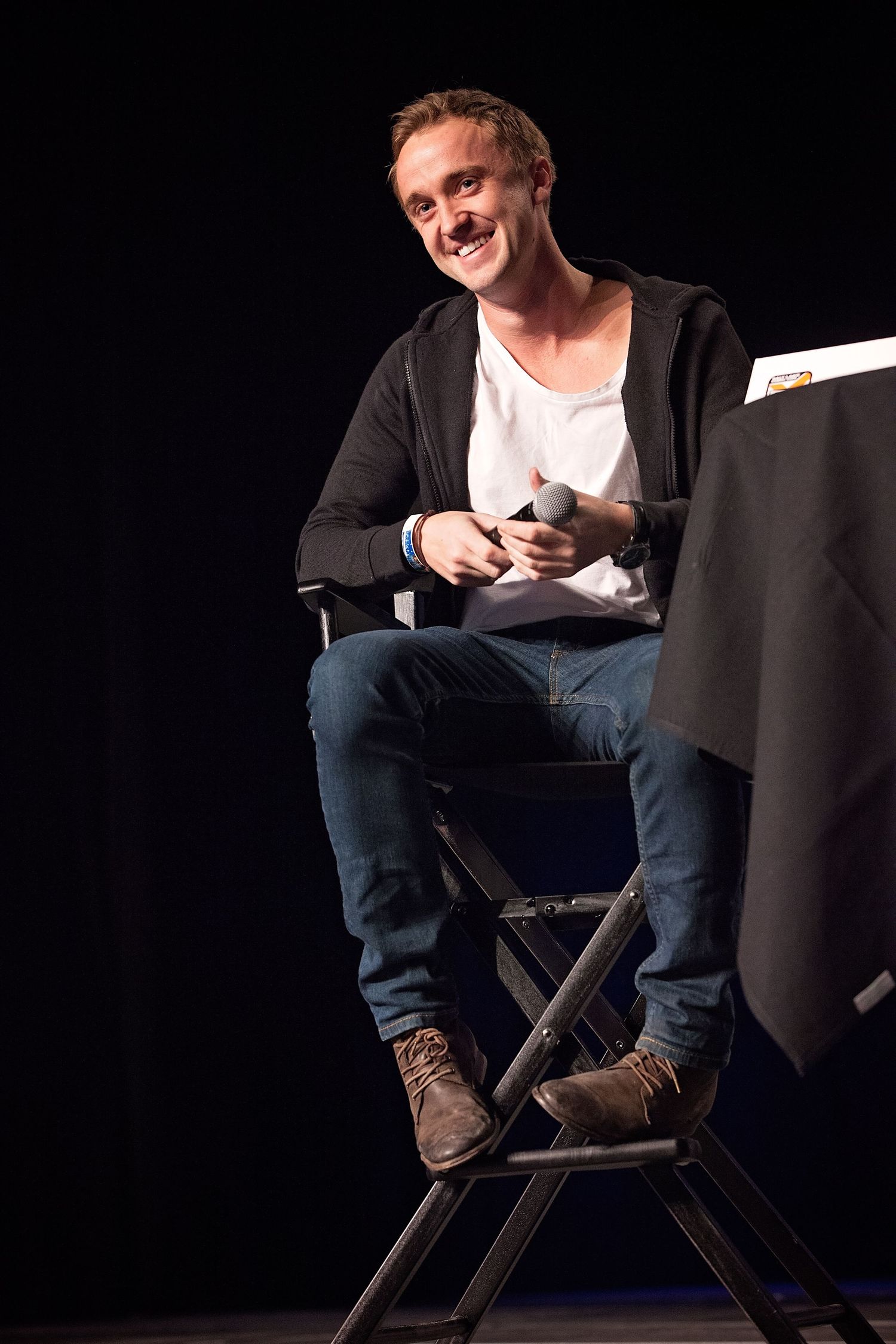 Draco Malfoy speaking onstage at FanX convention