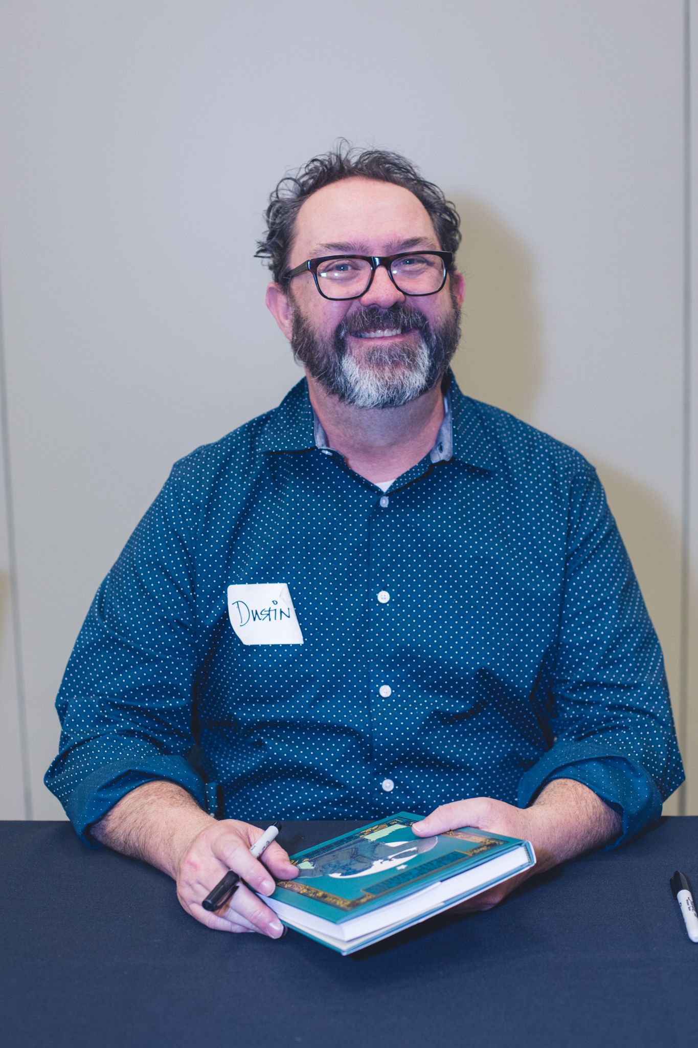 Author at StoryCon book signing.