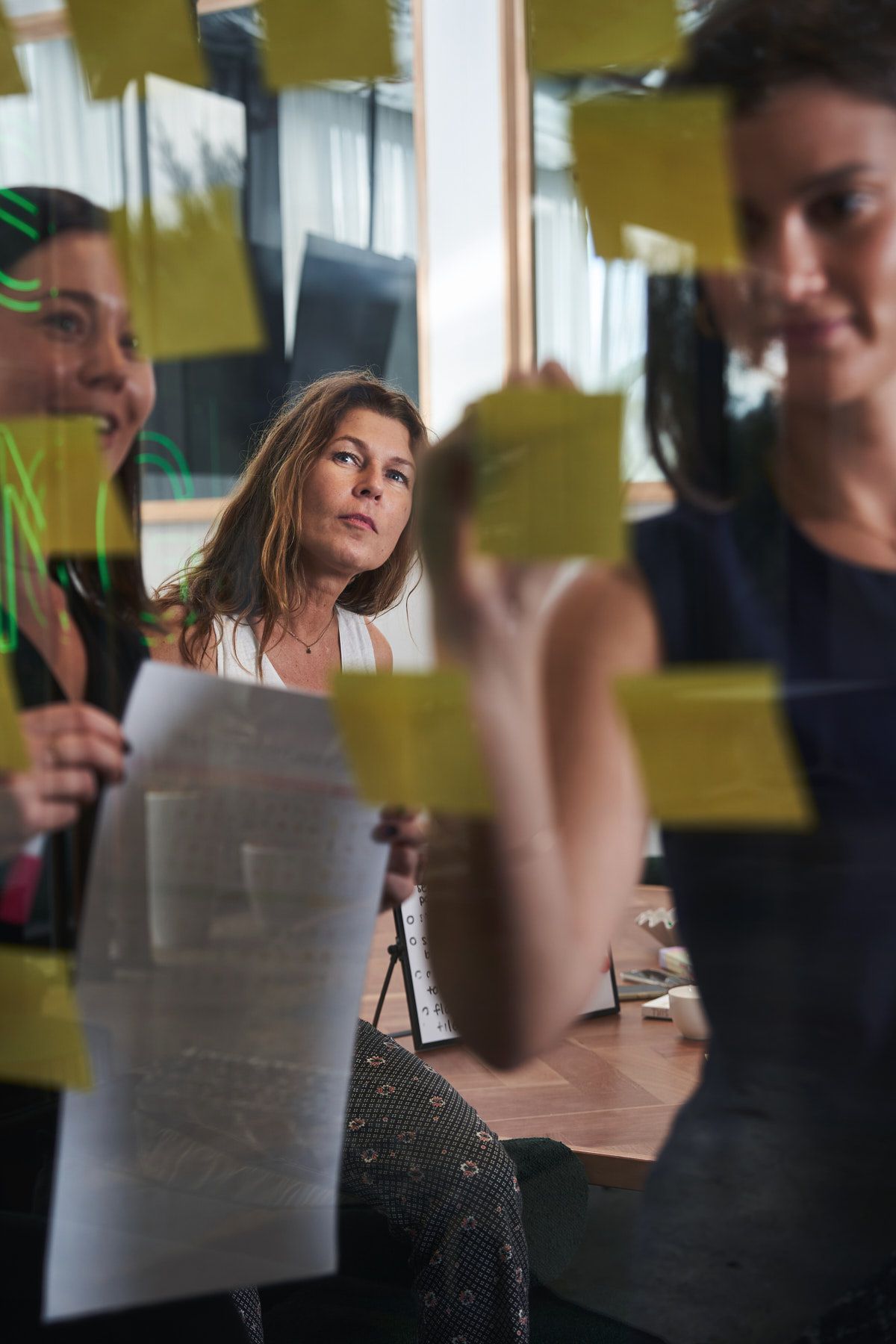 Business branding photography capturing team collaboration and meeting in a office. Shot by Sydney business branding photographer Tammy.