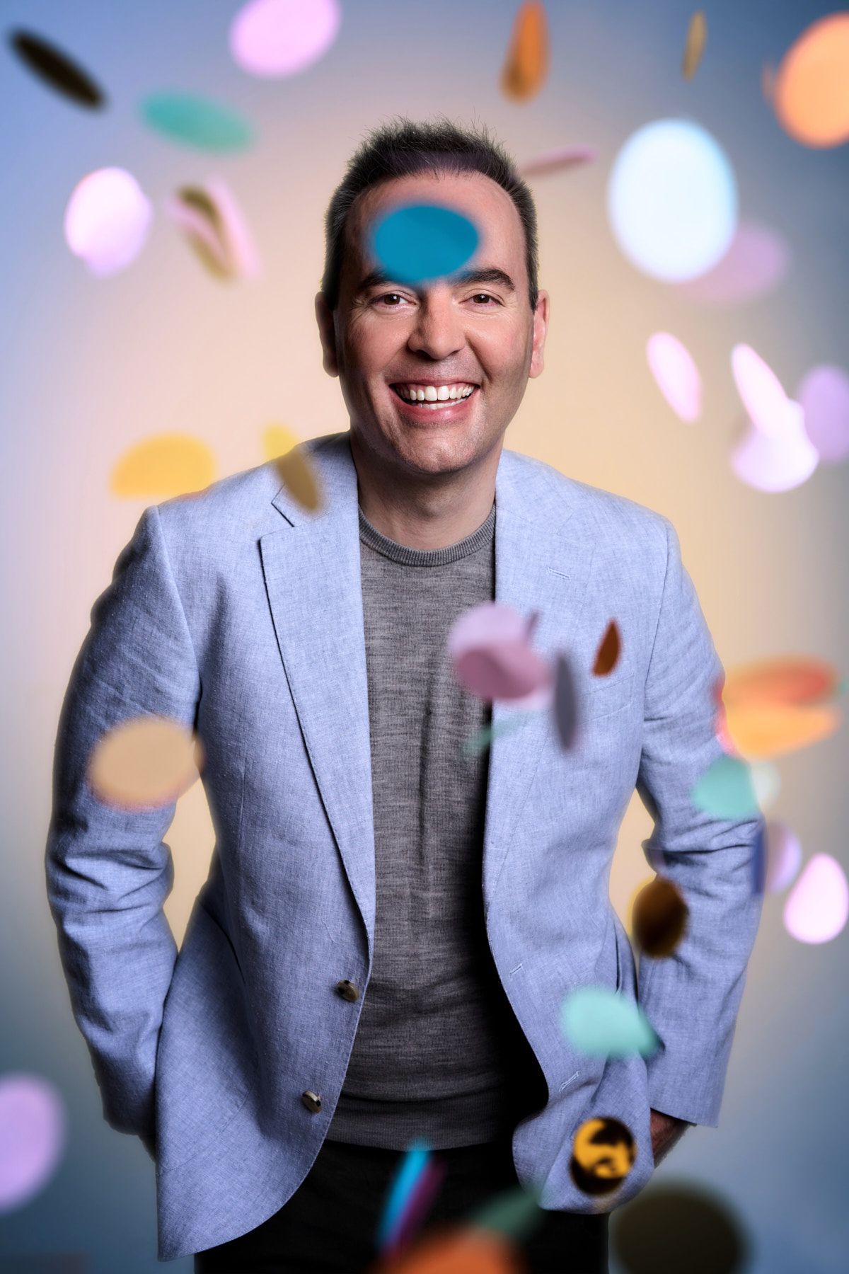 Creative personal branding photo of mental health coach with confetti during studio branding photoshoot in Sydney by Studio TingTing.
