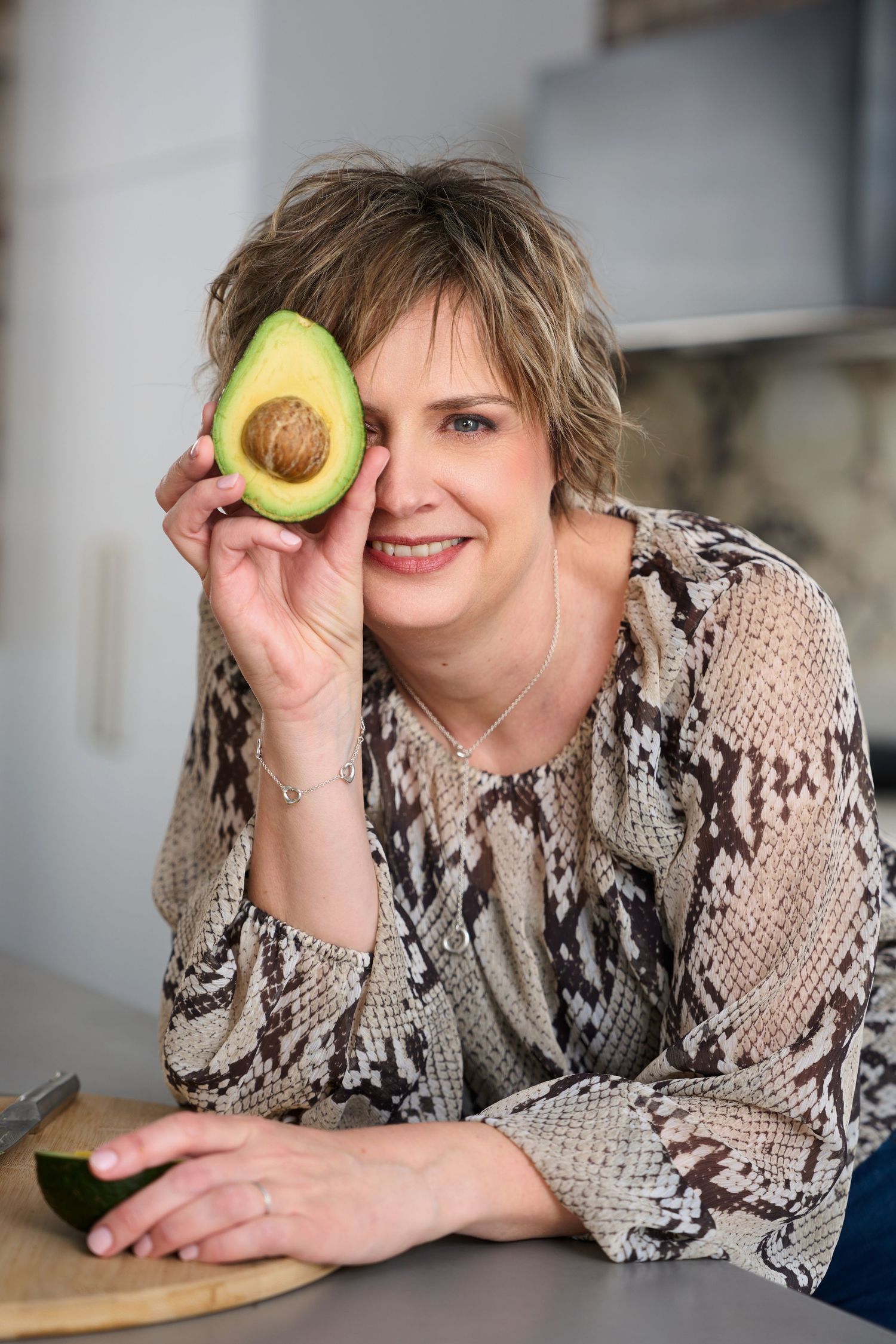 A lifestyle photo showing a nutritionist posing naturally in a kitchen setting. Directed and guided by Studio TingTing in sydney.