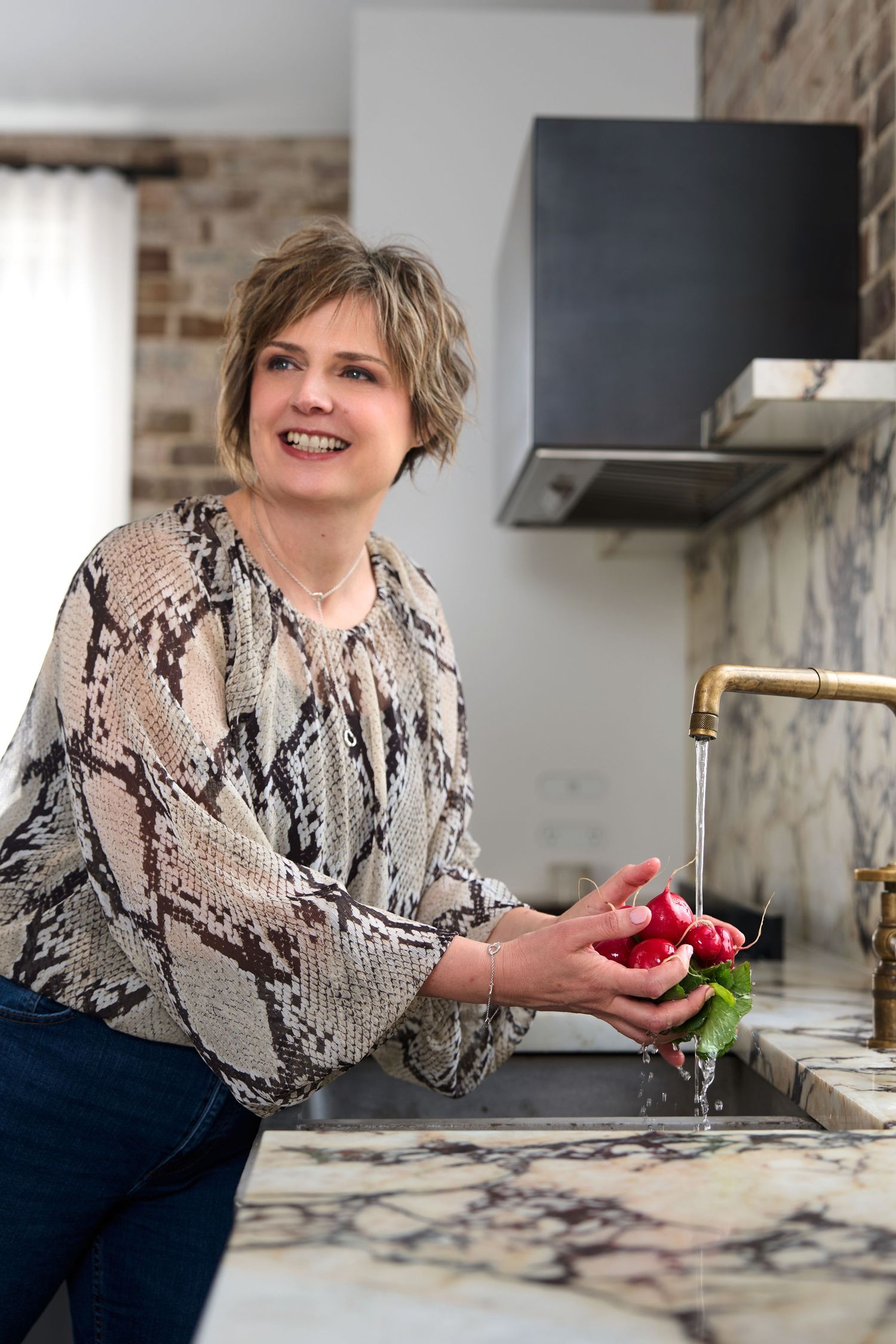 Nutritionist posing for professional business photos in a modern kitchen. Shot by Studio TingTing in Sydney.