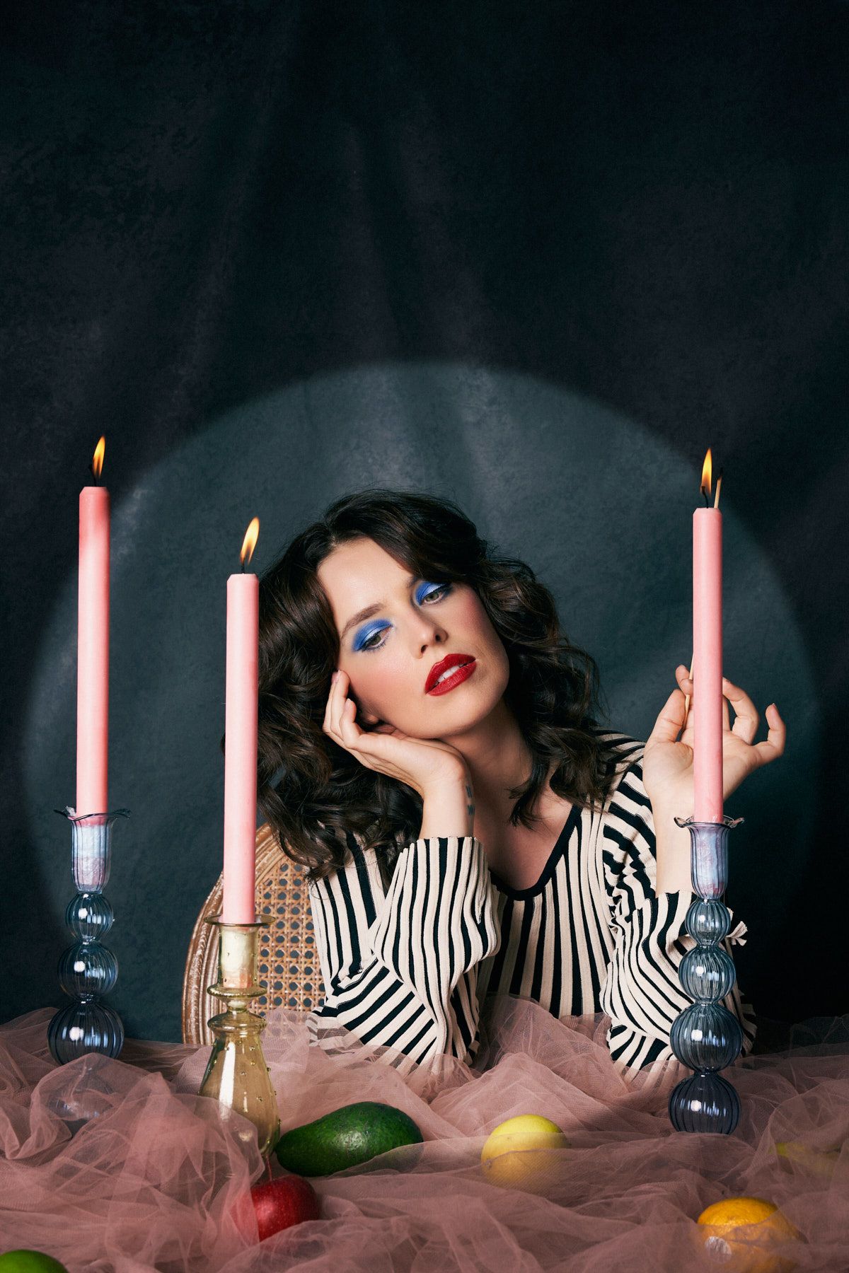 Creative personal branding photography session for Sydney based visual artist featuring candles and fruits on the table.