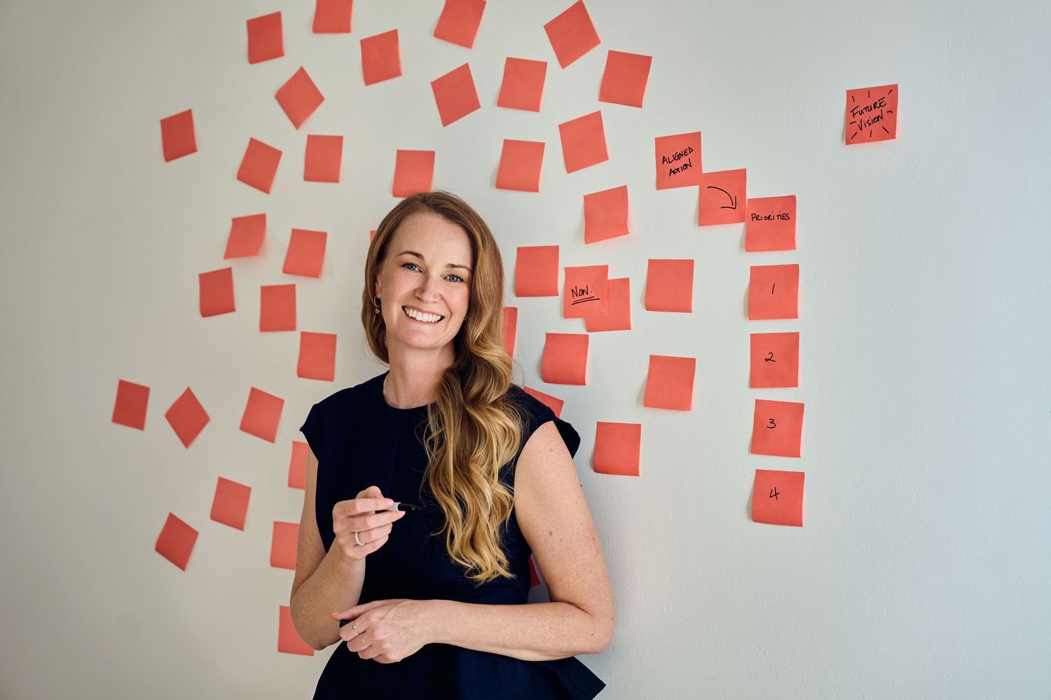 A sequence of candid lifestyle branding photos showing someone posing against a wall decorated with orange sticky notes by Studio TingTing.