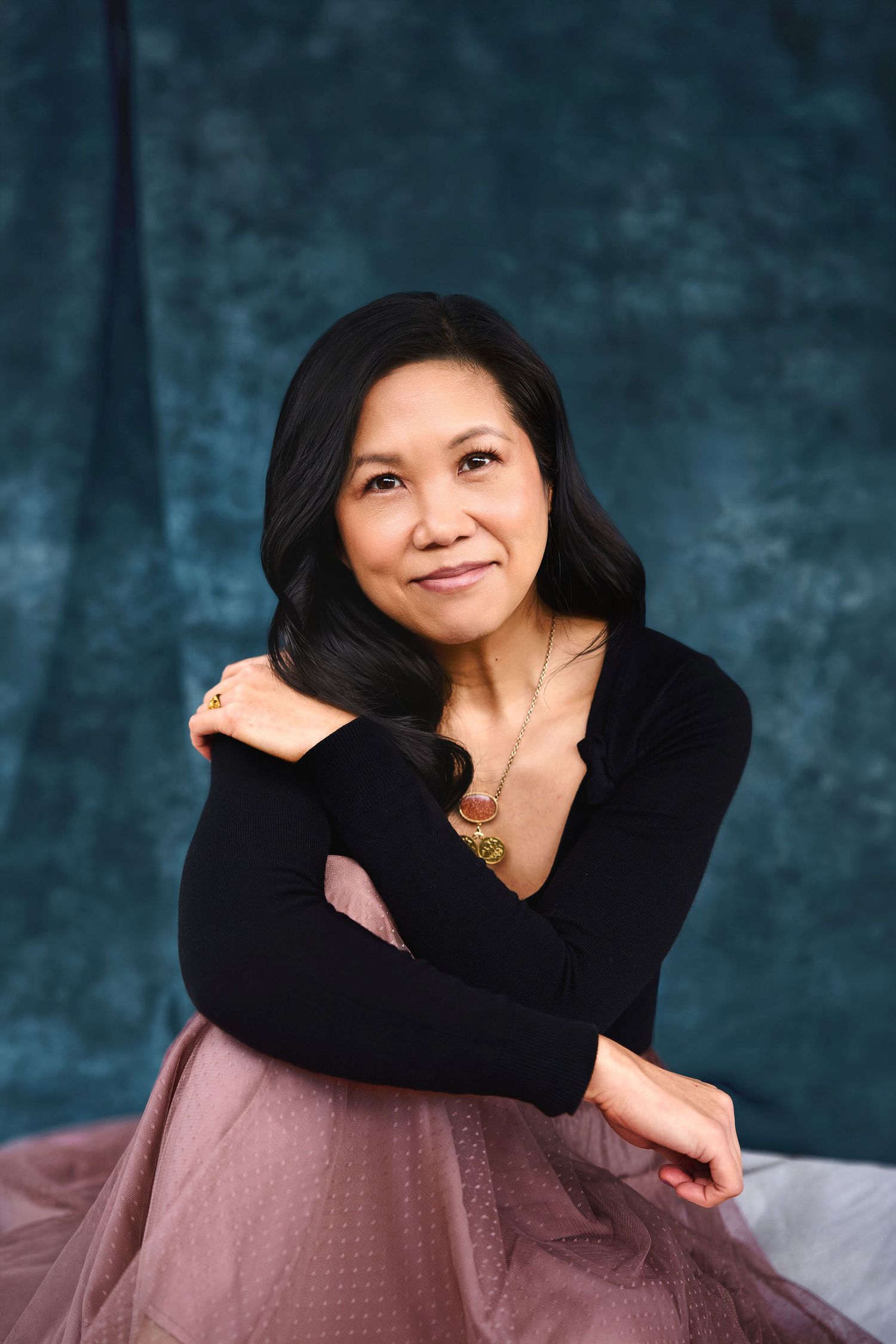 Warm seated branding portrait for Sydney content educator, Studio TingTing.