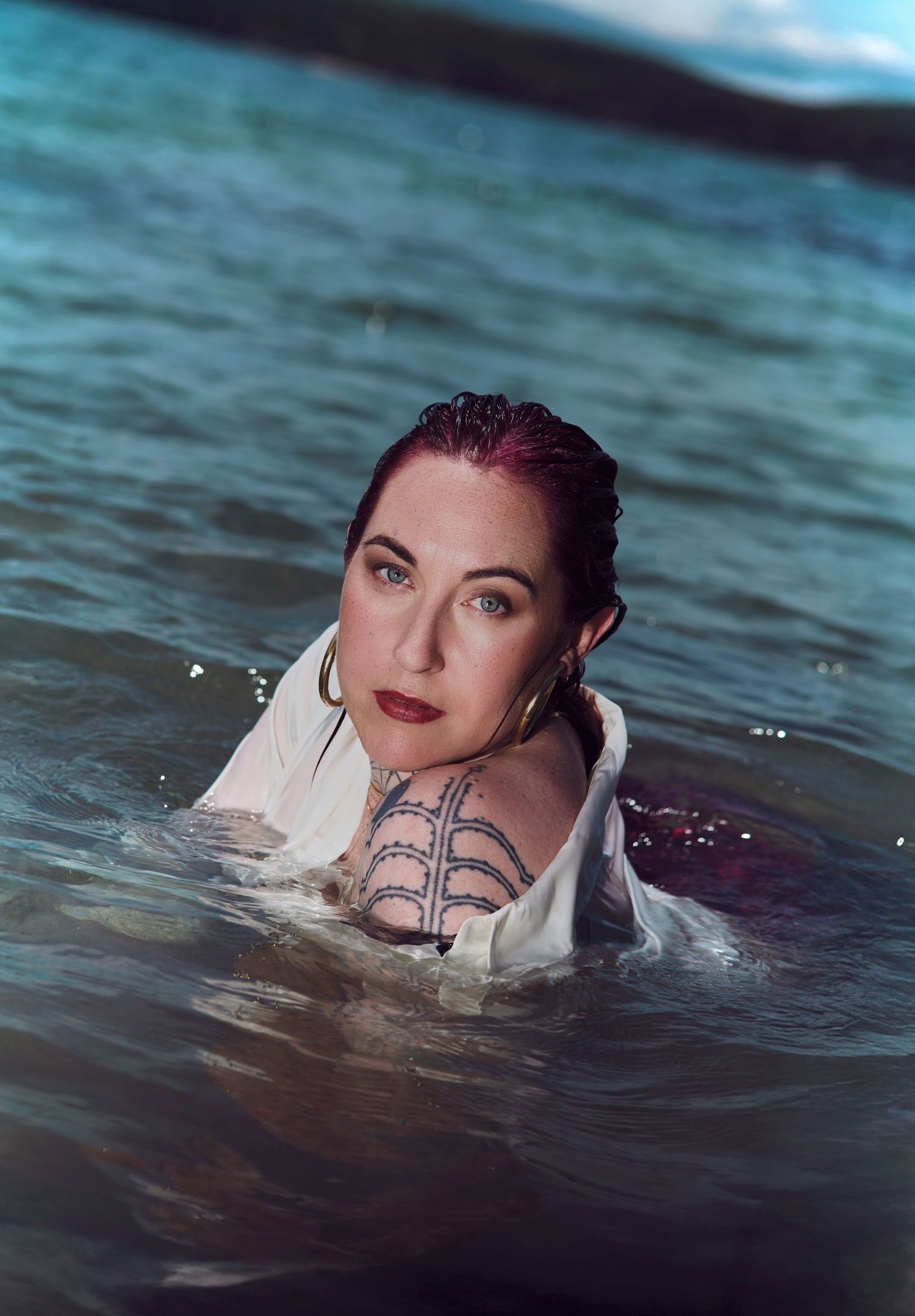 A dramatic underwater portrait of a business mystic shot by Sydney professional photographer Tammy TingTing.