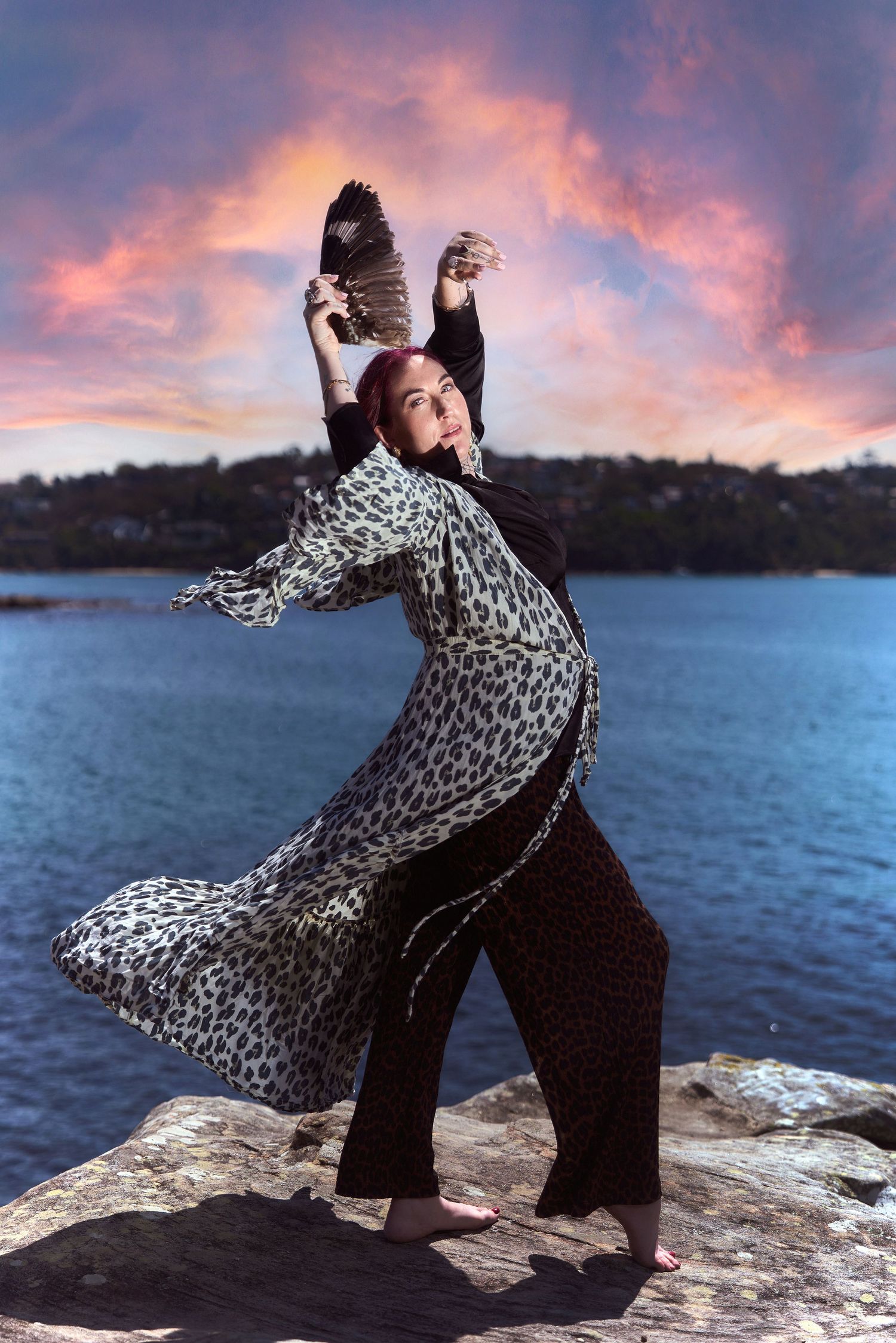 A female business mystic posing against a sunset backdrop in sydney by Sydney personal branding photographer Tammy TingTing.