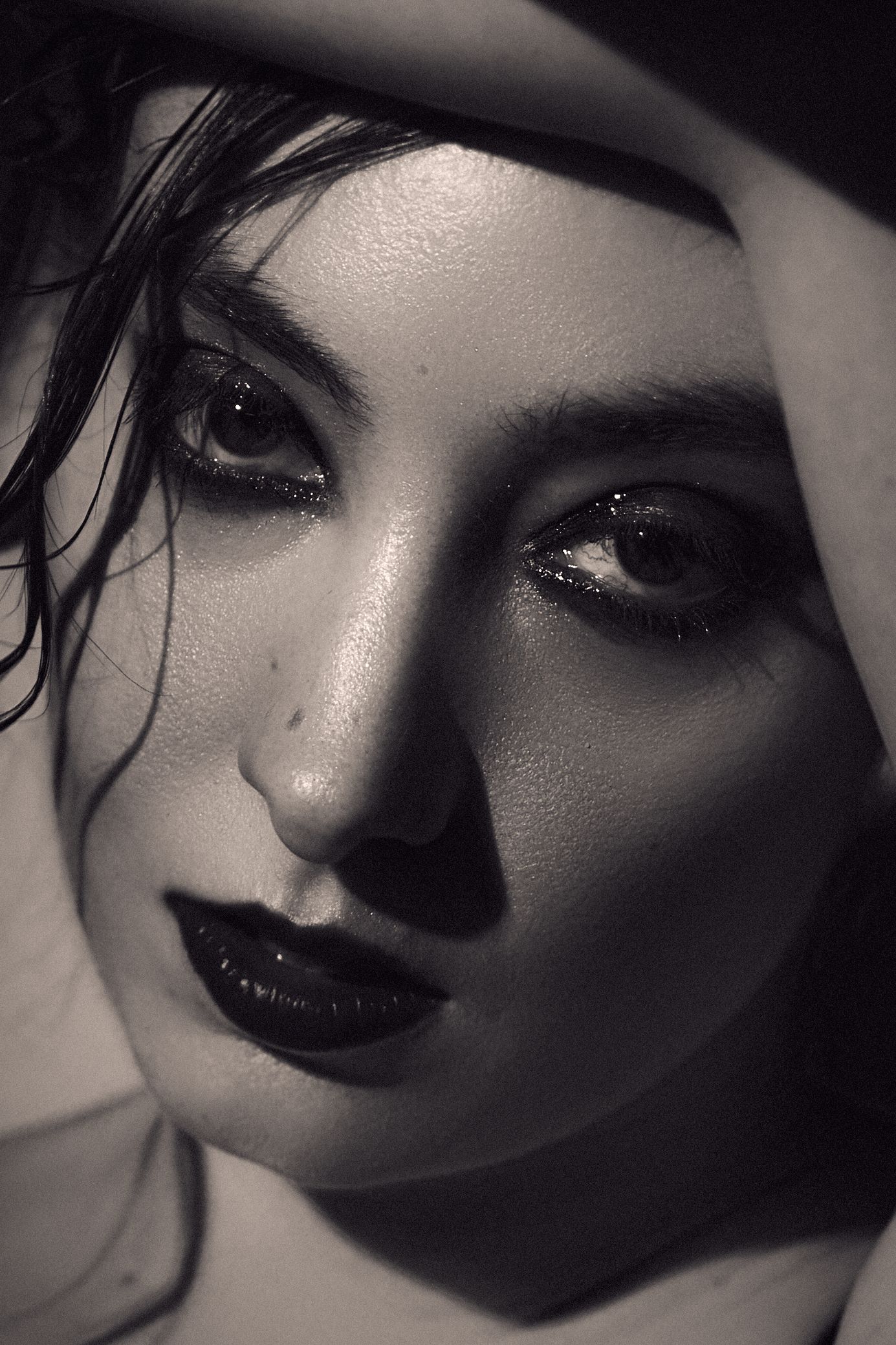 A dramatic black and white headshot series of a model. Shot by Sydney professional photographer Tammy TingTing.
