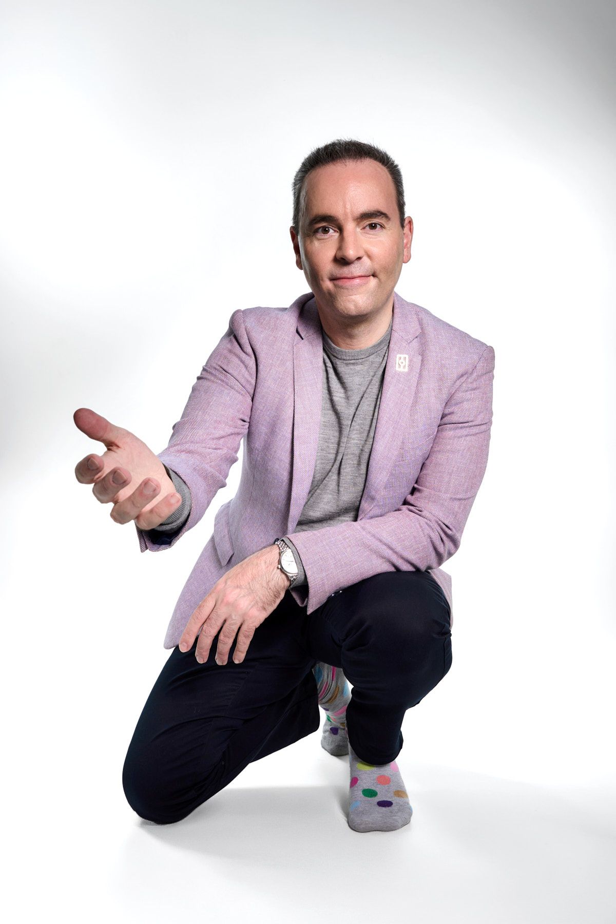 Professional portrait of mental health coach kneeling during personal branding photoshoot in Sydney by Studio TingTing.