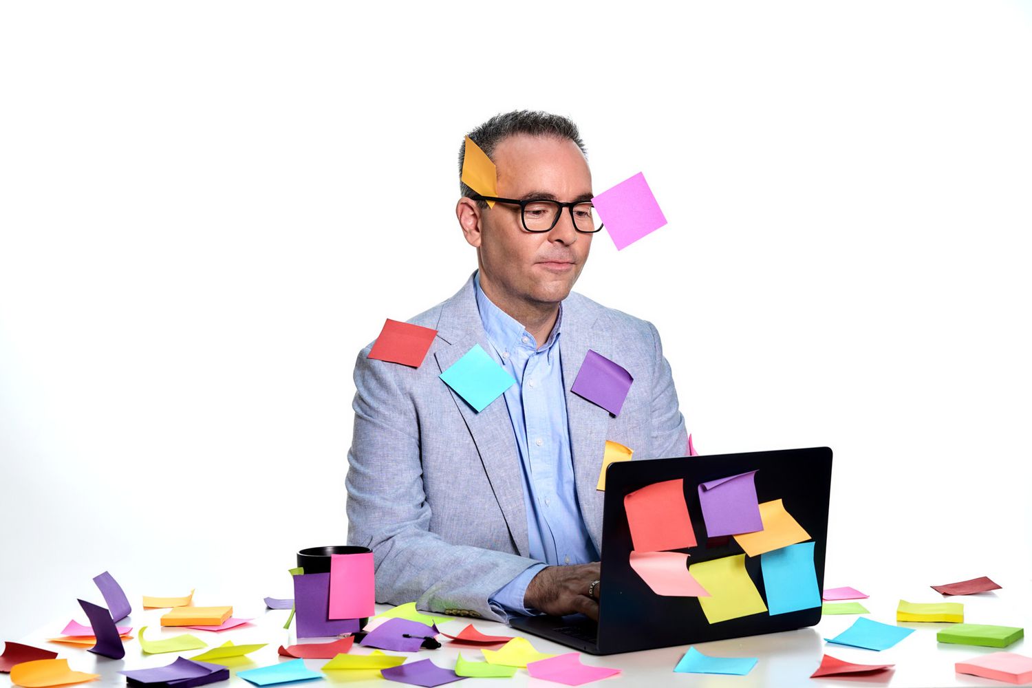 Branding photo of coach working on laptop surrounded by colourful post-it notes in Sydney by Studio TingTing.