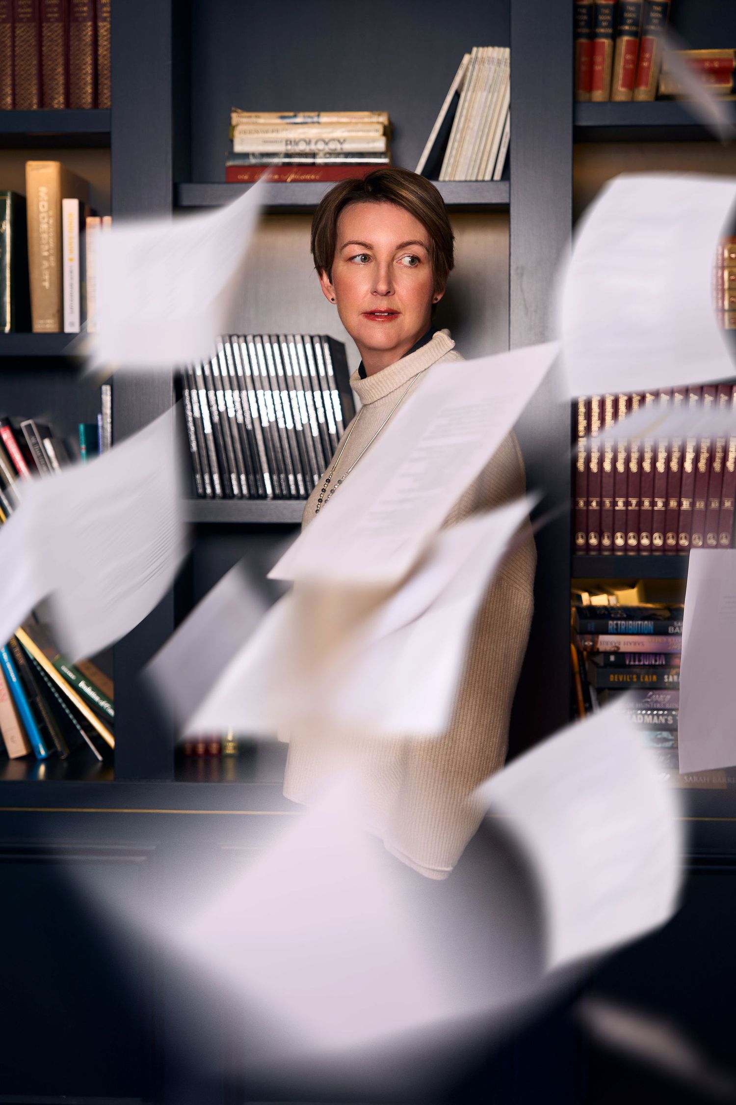 Personal branding photography session in Sydney. Script scattered everywhere infant of a Fiction Author. Shot by Studio TingTing.
