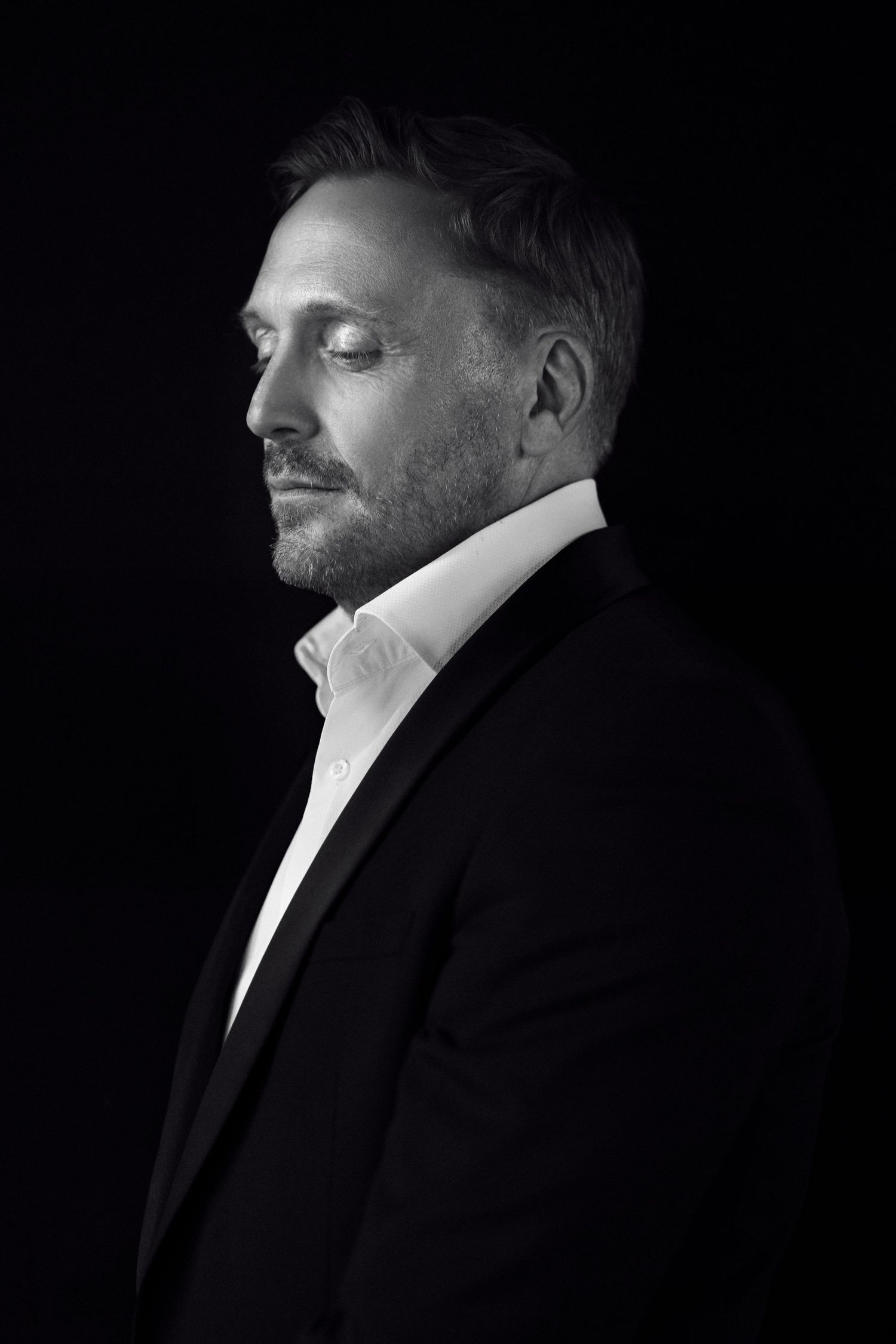 Side profile black and white headshot of a founder ifor personal branding photography session by Studio TingTing in sydney studio.