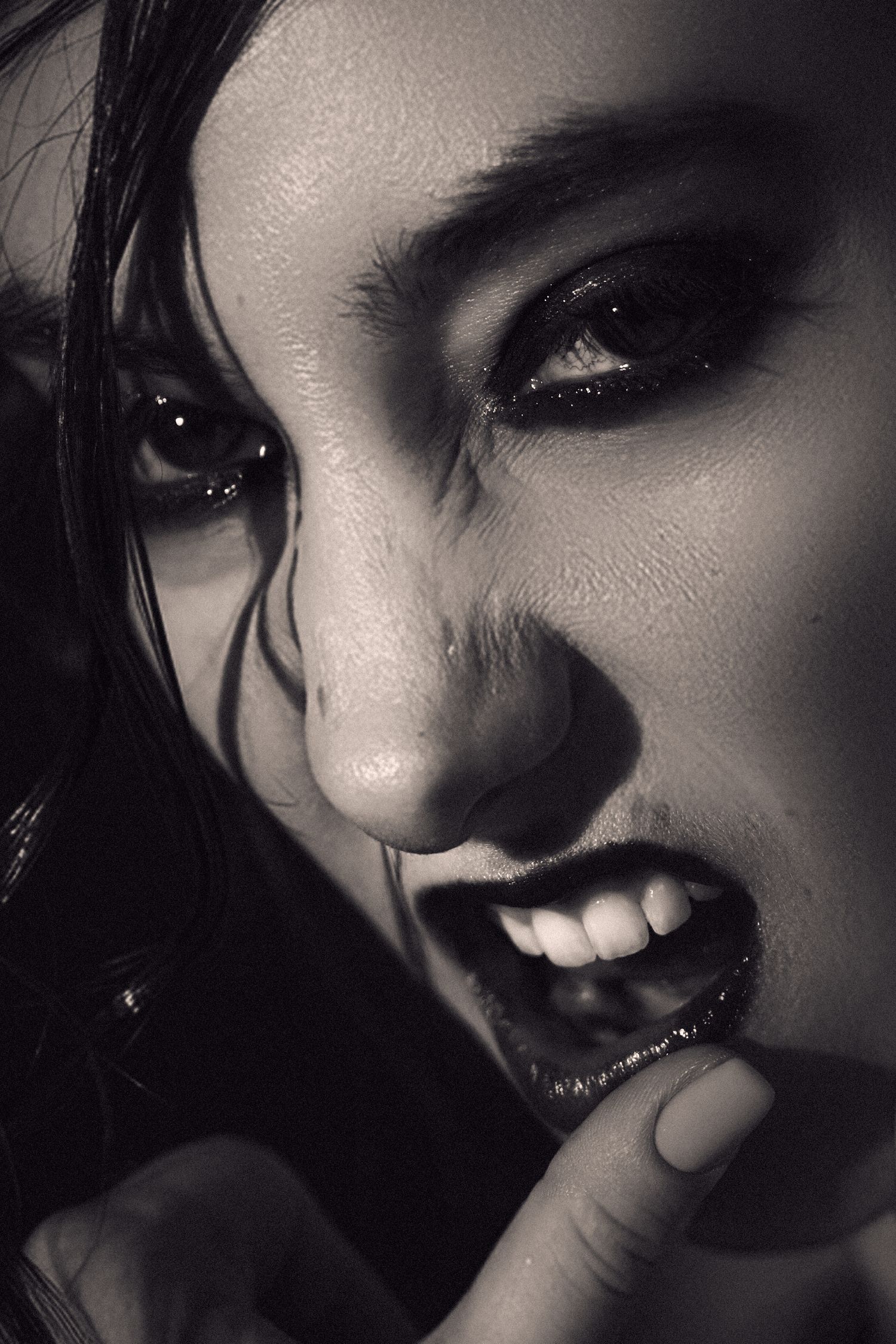 Aspiring model in dramatic black and white close-up portrait sequence showing expressions and range. Shot by Sydney photographer Tammy.