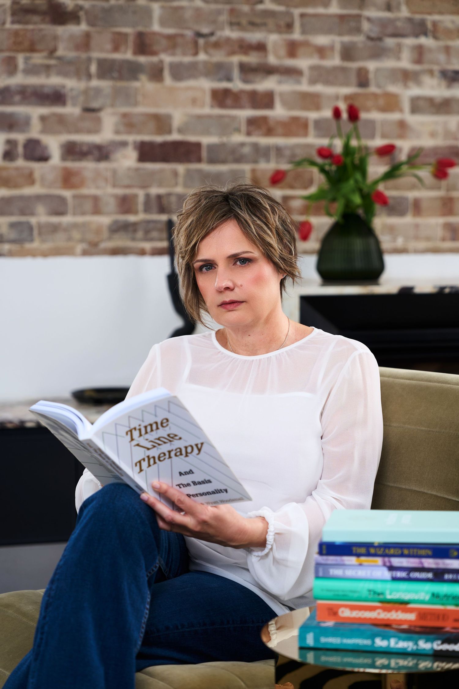 Nutritionist posing for headshot shot by Studio TingTing in Sydney in lifestyle relaxed setting.