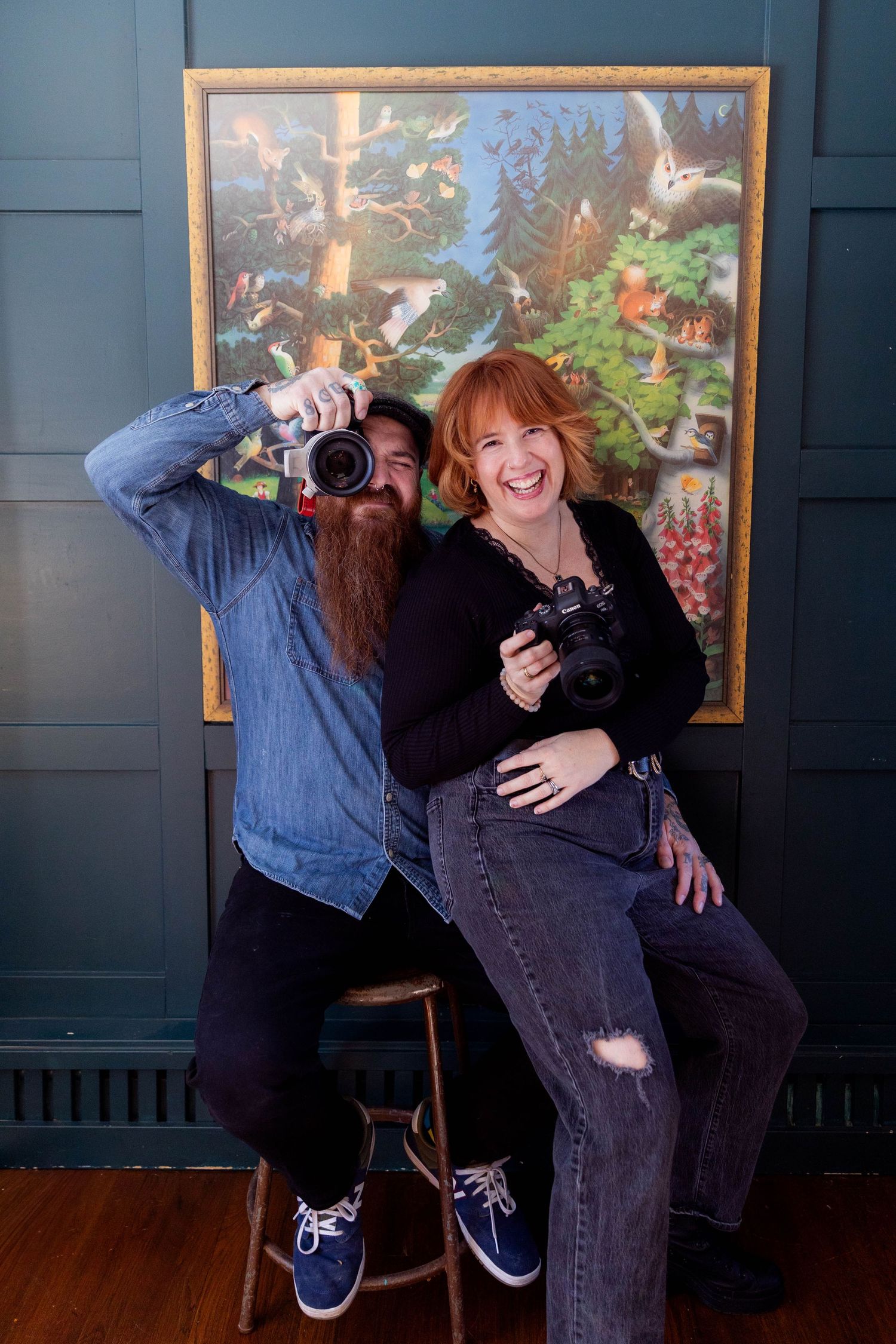 A sequence of five photos shows two photographers playfully posing and interacting during a photo session.