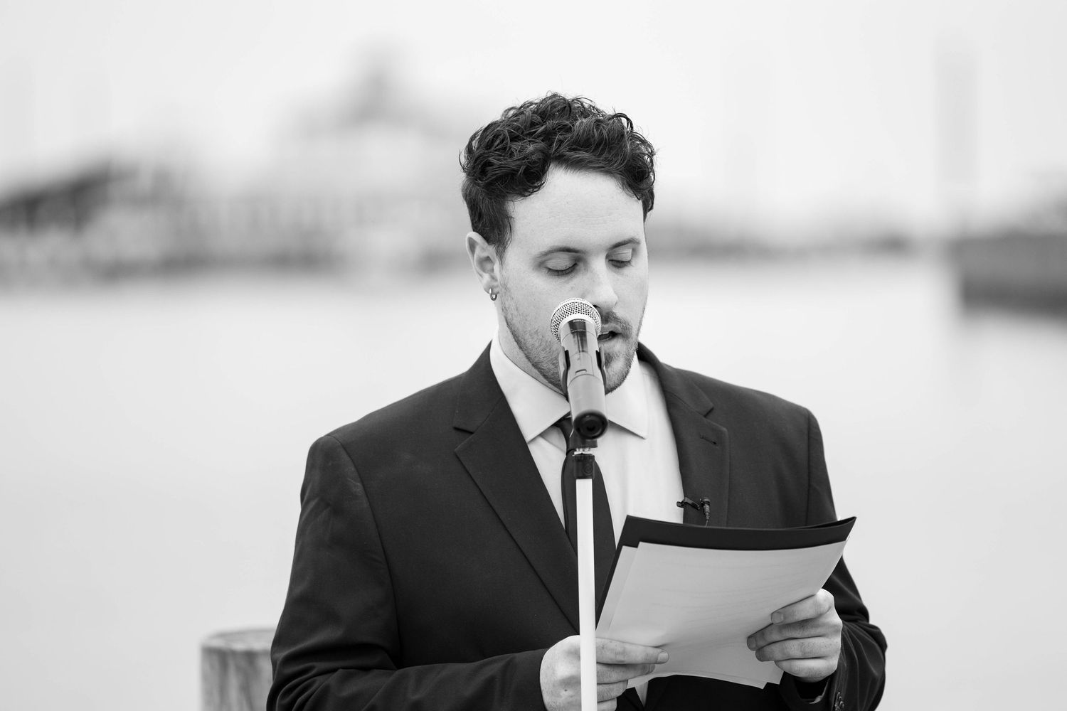 A black and white photo sequence showing a person in a suit reading a letter with emotional expressions.