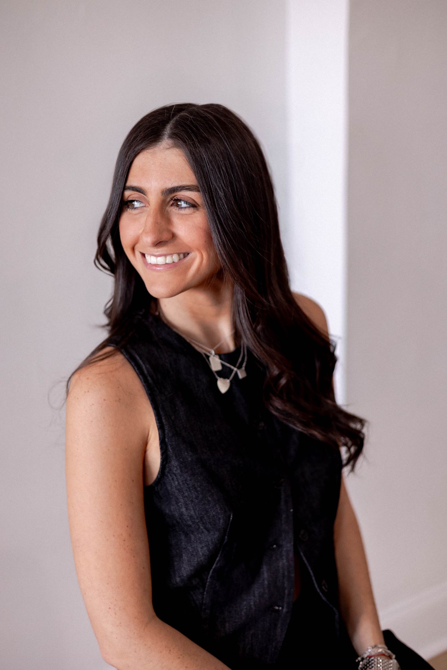 Portrait series showing joyful expressions against a bright white studio backdrop.