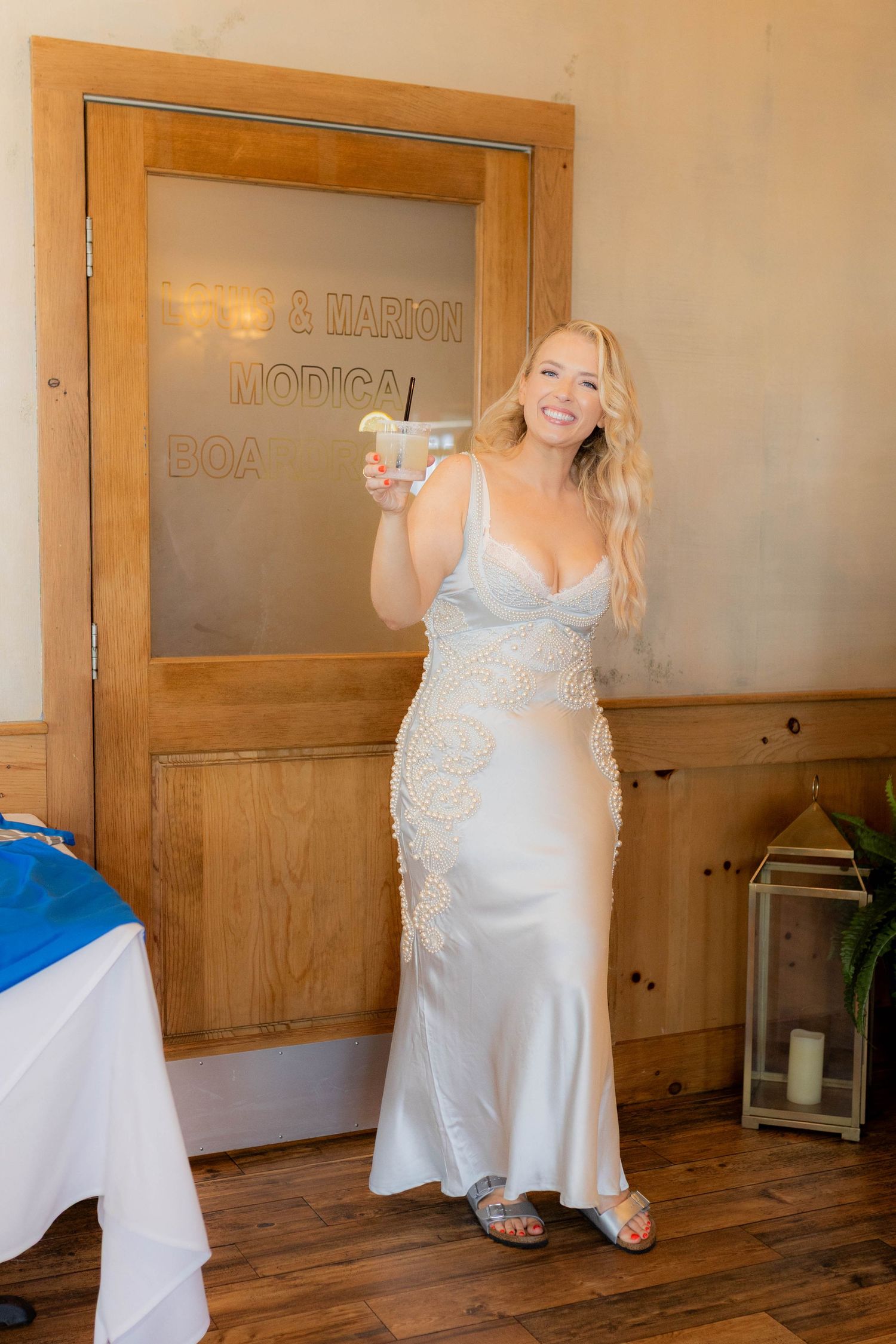 A sequence of photos showing someone in a white lace dress posing against wooden paneled walls in a rustic interior.