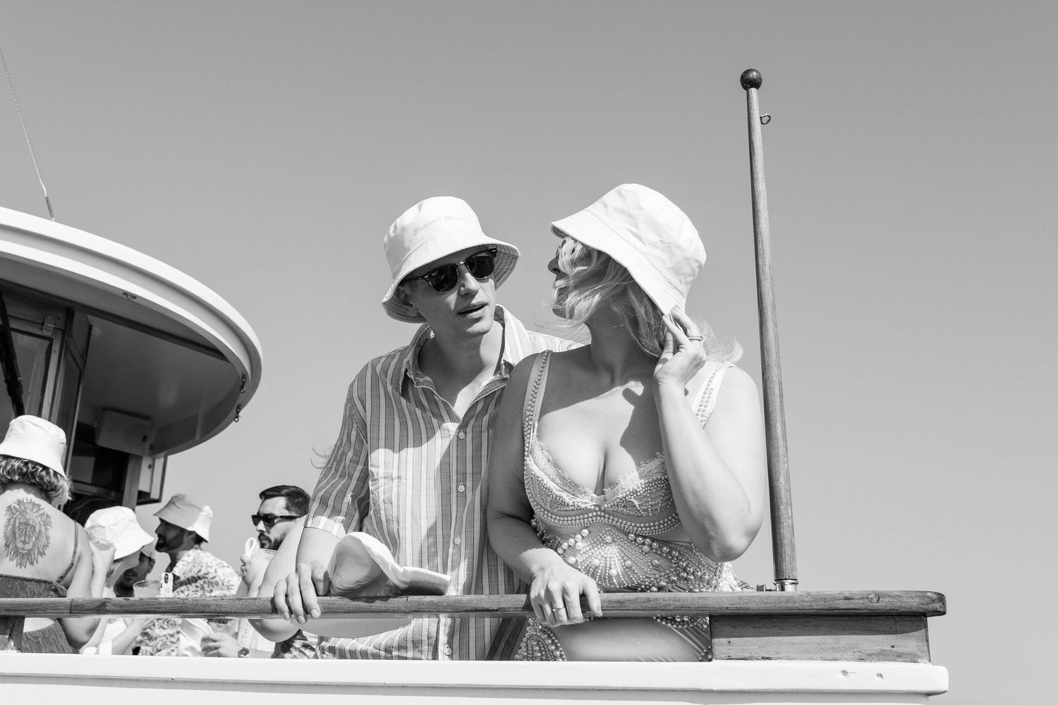 Black and white photo series showing chefs preparing food in a professional kitchen.