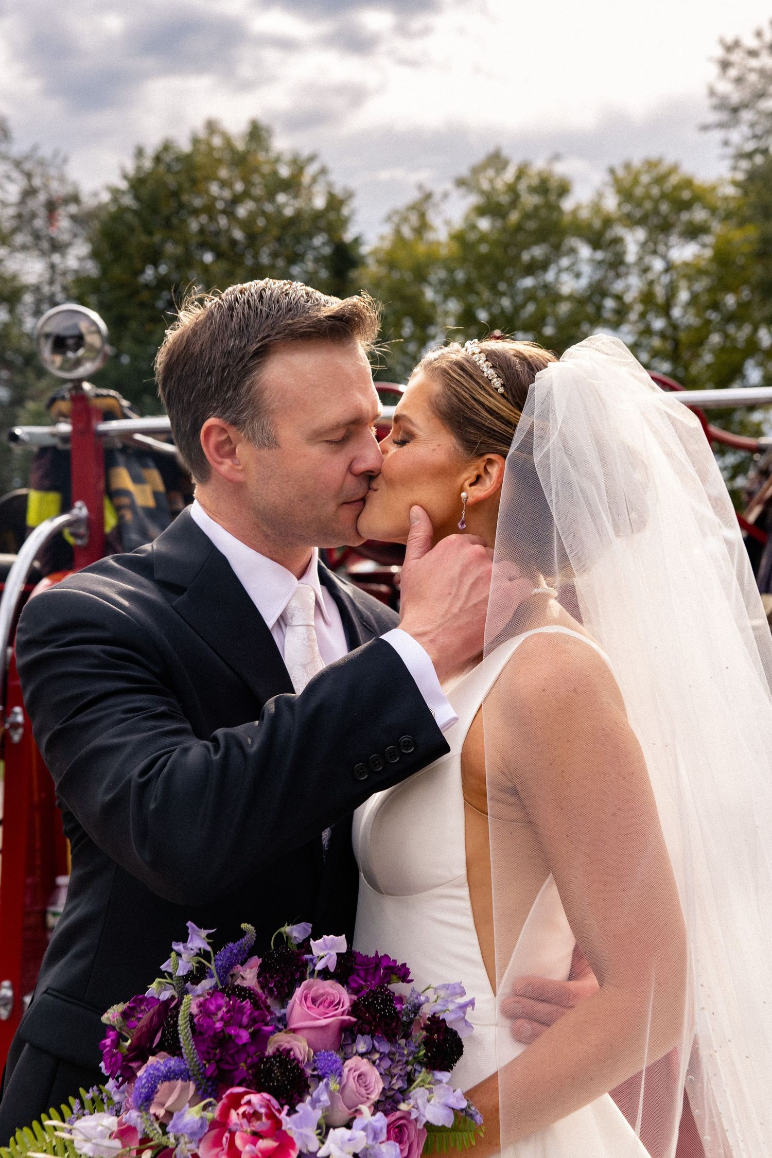 A series of romantic wedding photos showing a couple sharing kisses outdoors with purple floral bouquet details.