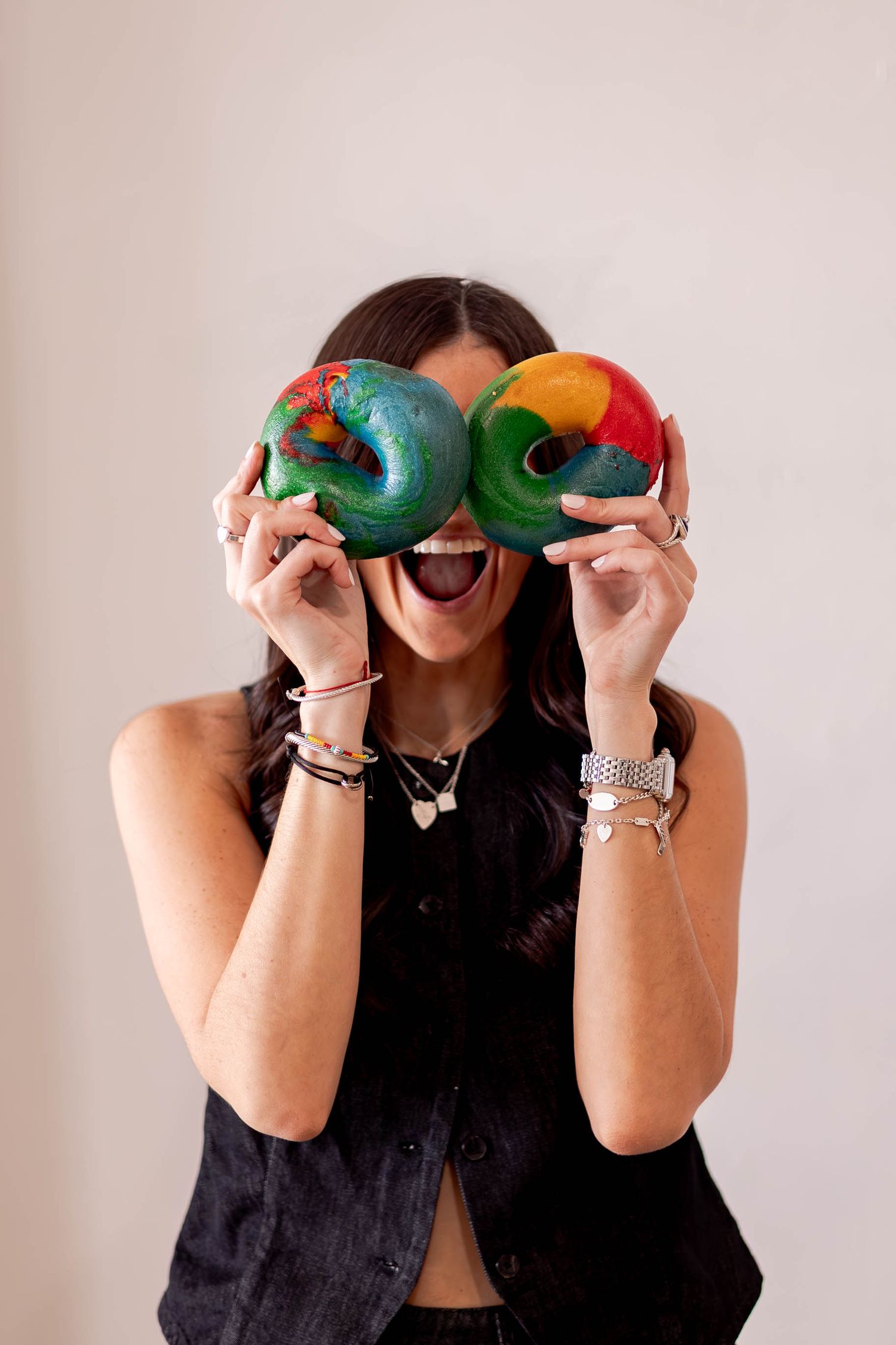 Creative photo sequence using colorful fruits held up playfully against white background.
