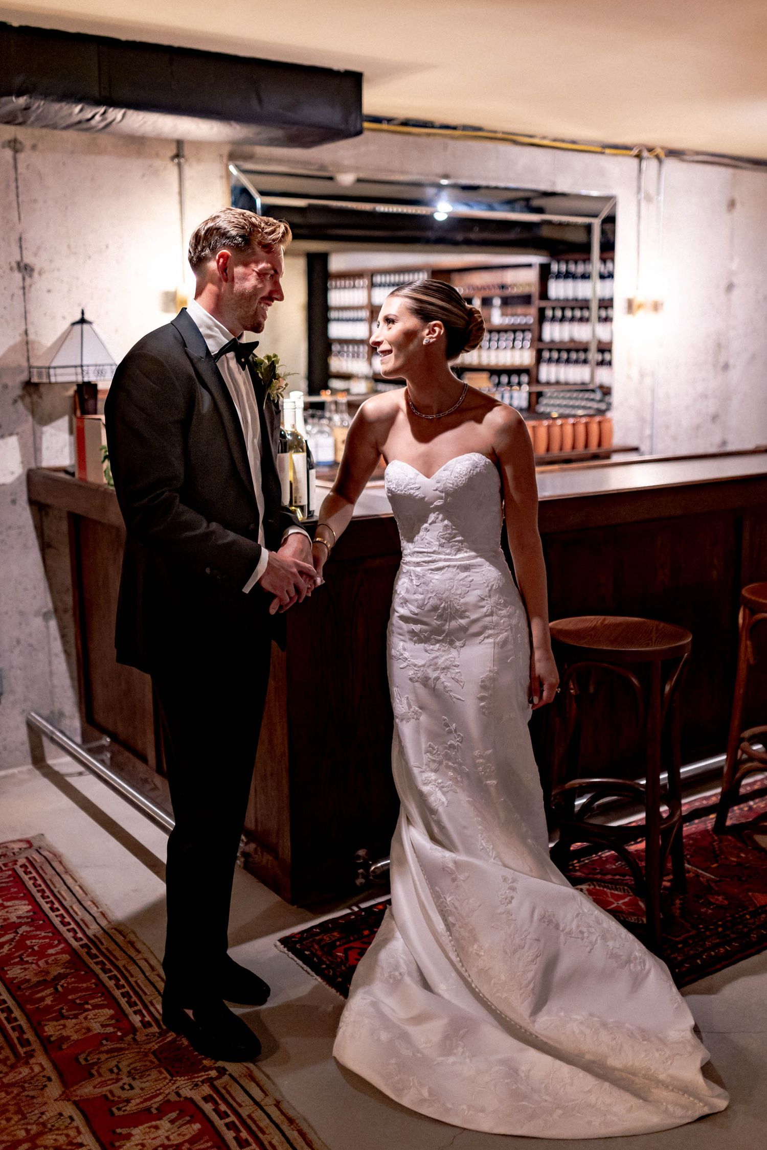 A romantic wedding scene in a church shows a couple sharing an intimate moment in their formal attire.