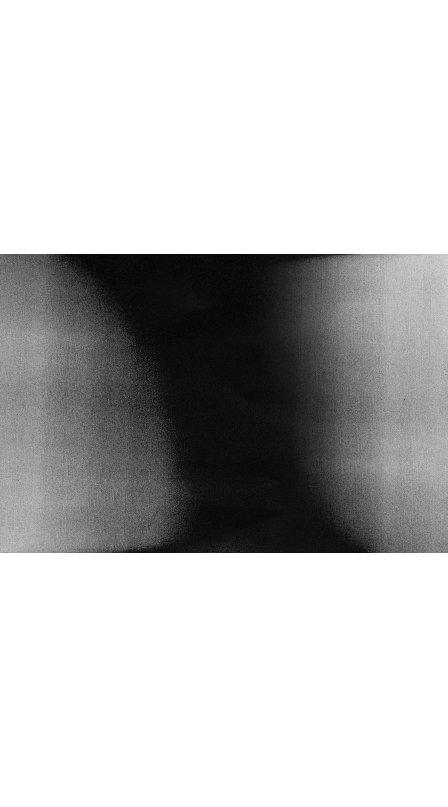 Abstract dark grayscale texture with soft gradient shadows and light edges creating a dramatic contrast pattern.