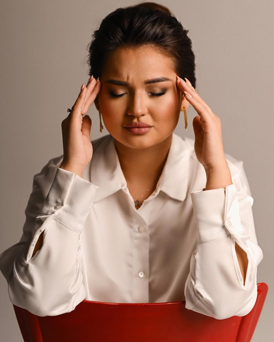 A thoughtful business portrait of a female entrepreneur, emphasizing focus and leadership for corporate profiles.