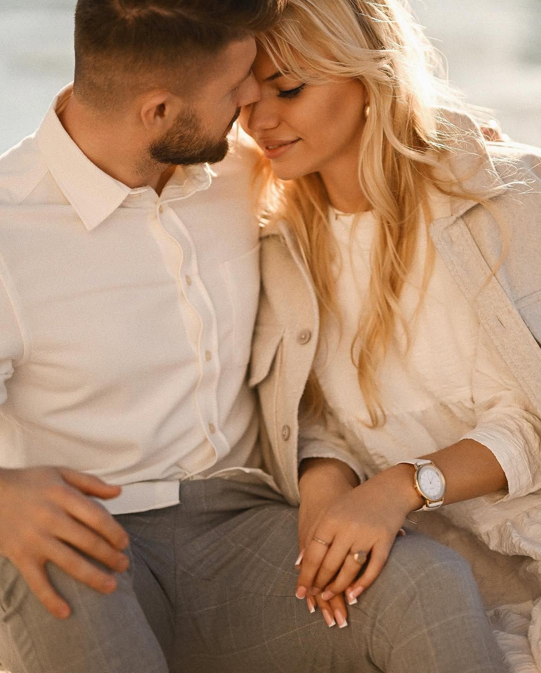 Intimate couples portrait sitting together with soft natural light during an engagement session in Valencia