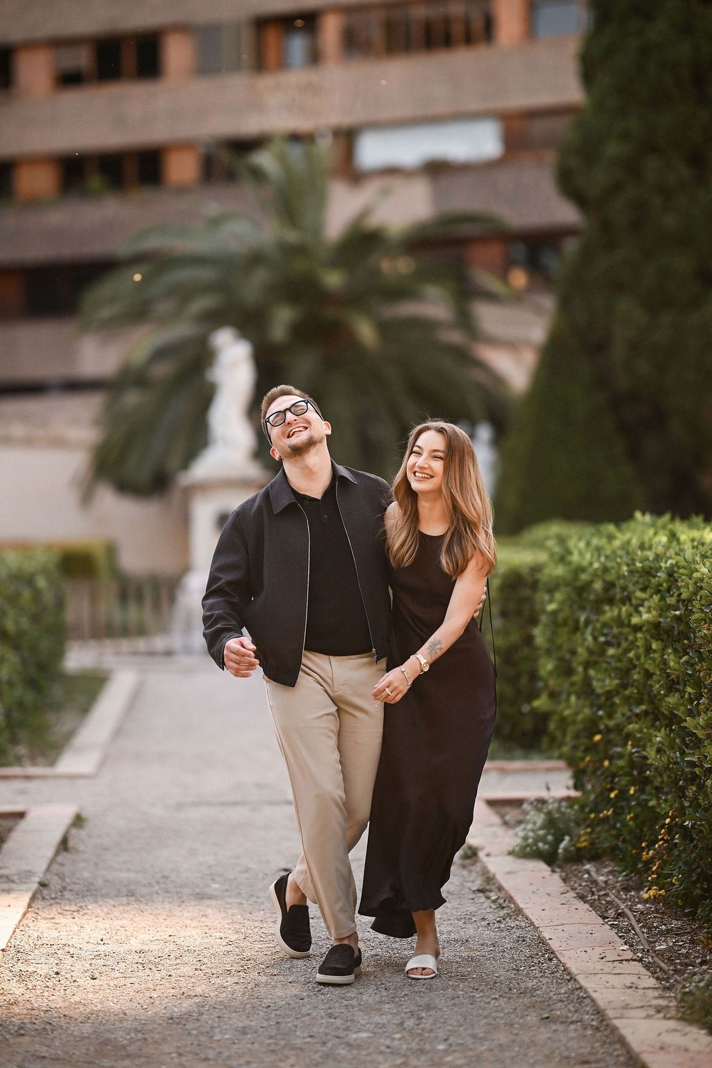 Joyful couple laughing during a Valentine's Day photoshoot in Valencia for a romantic couples session