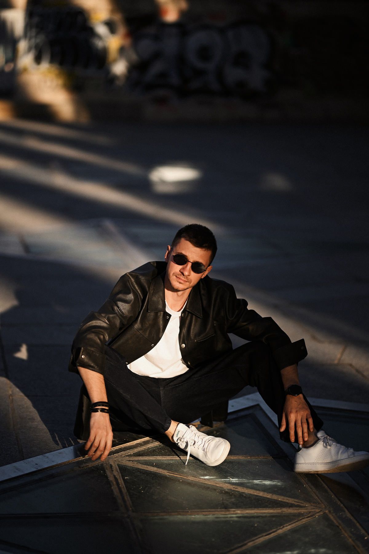Editorial and geometric male portrait session at the City of Arts and Sciences in Valencia, featuring structured lighting.