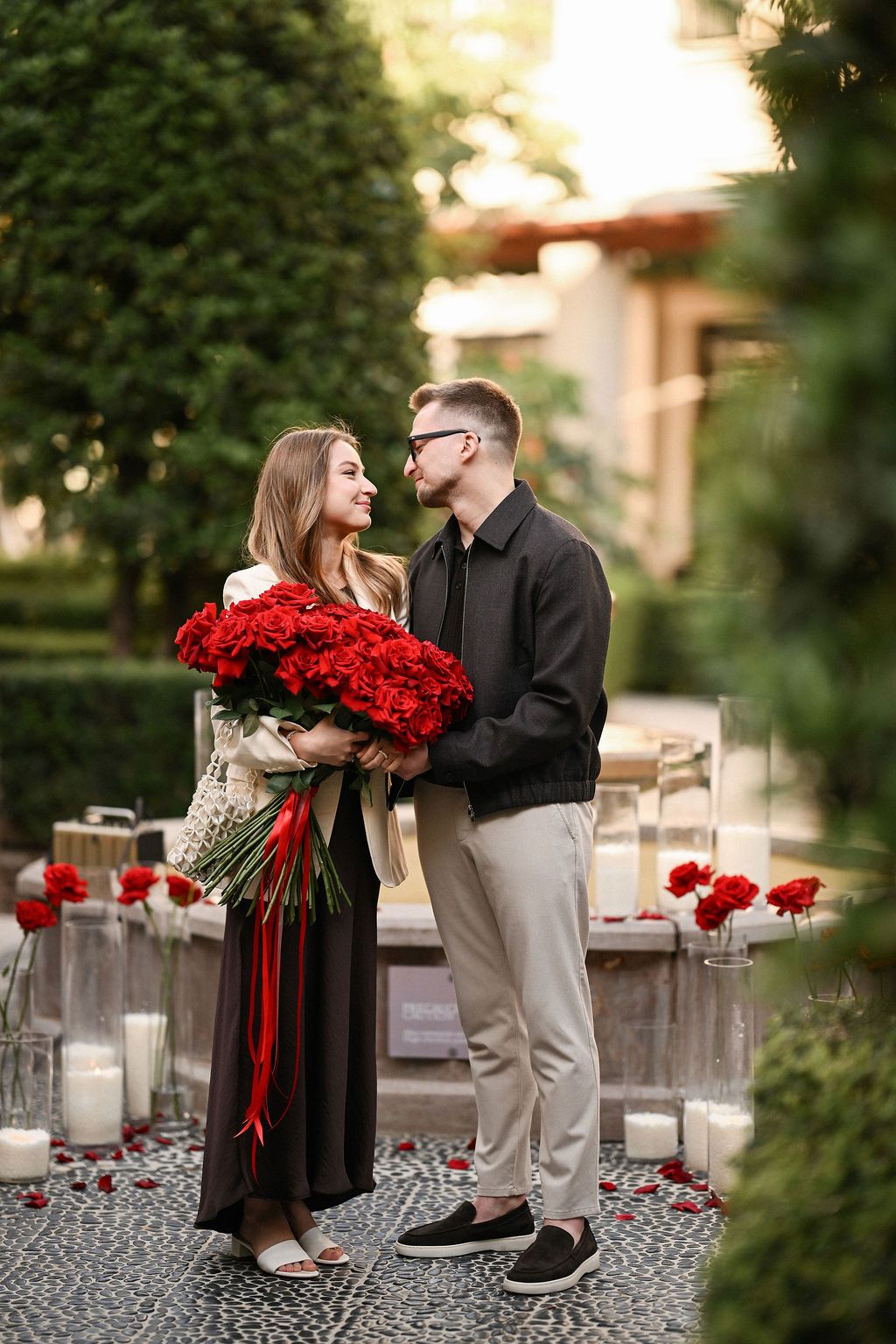 Man gifting red roses during a Valentine's Day couples photoshoot in Valencia