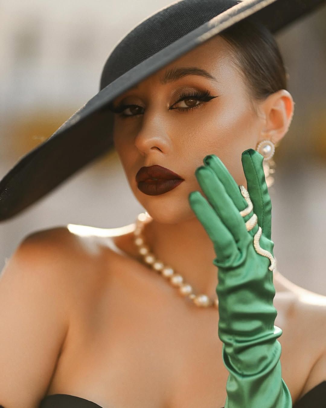 A close-up editorial portrait featuring detailed professional makeup and expert styling from our premium fashion session.