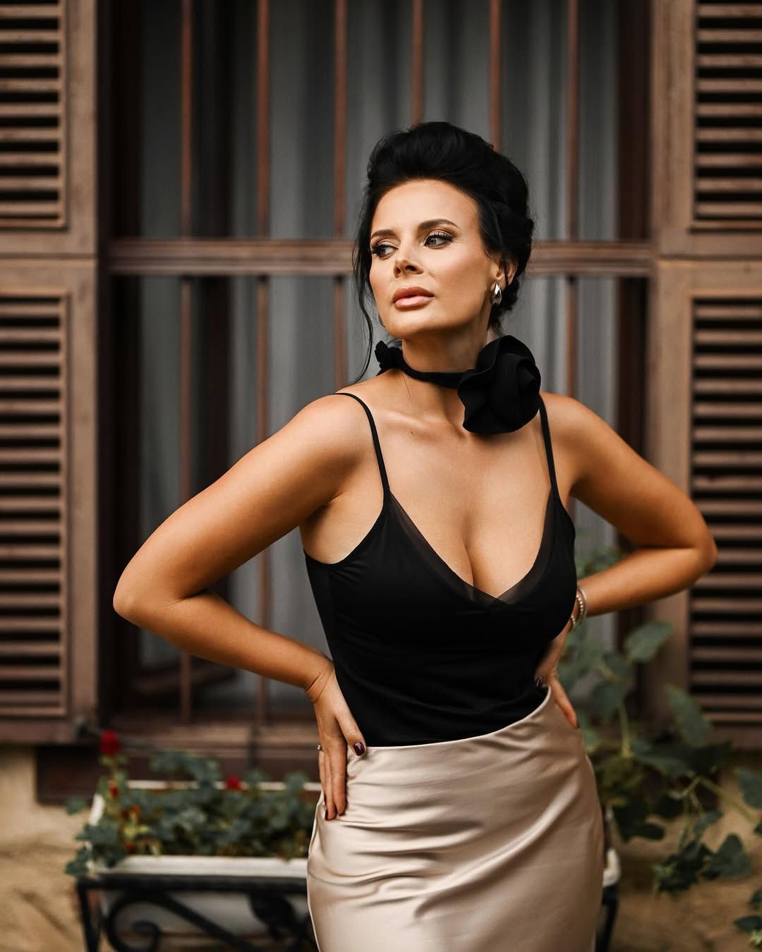 A medium portrait highlighting flawless professional makeup and styling during a premium all-inclusive photoshoot session.