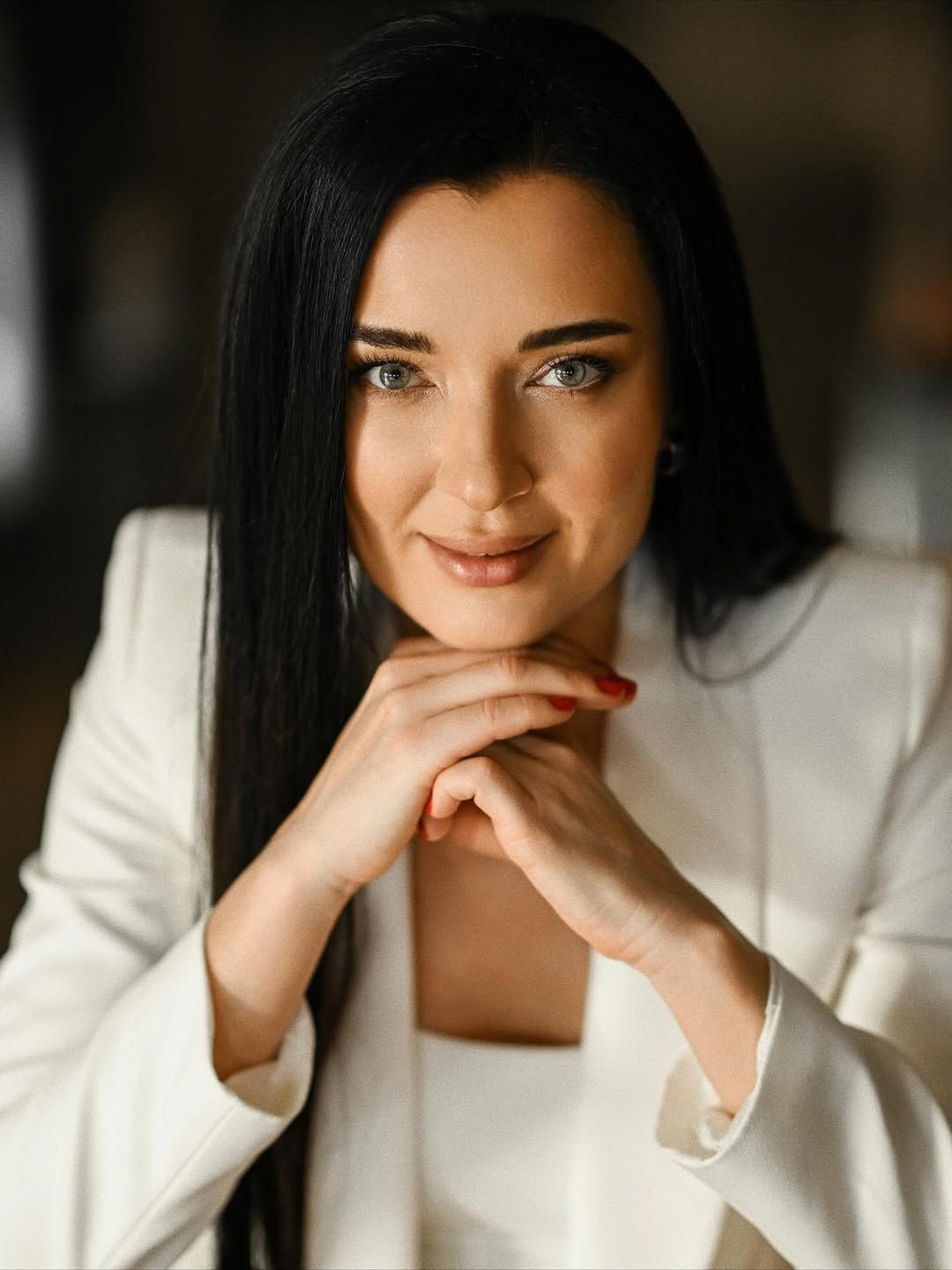 A close-up portrait of a professional coach, emphasizing expertise for speaking engagements and visual identity.
