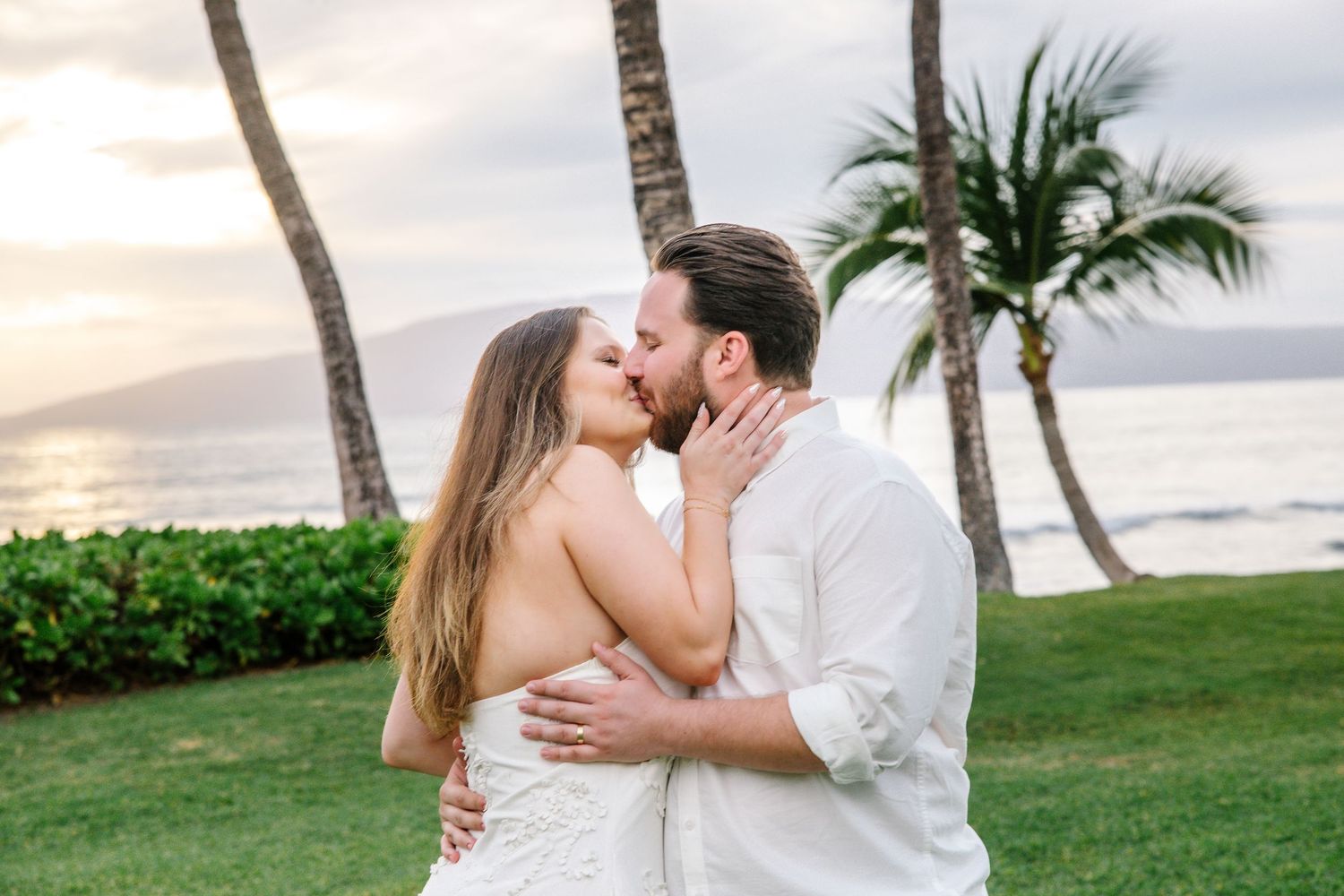Romantic moments captured on a Hawaiian beach at sunset.