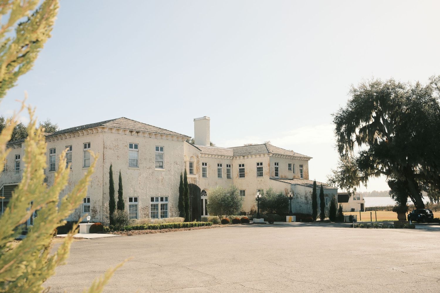 A panoramic collage of a beige stone building exterior with multiple views showing different angles and landscaping.