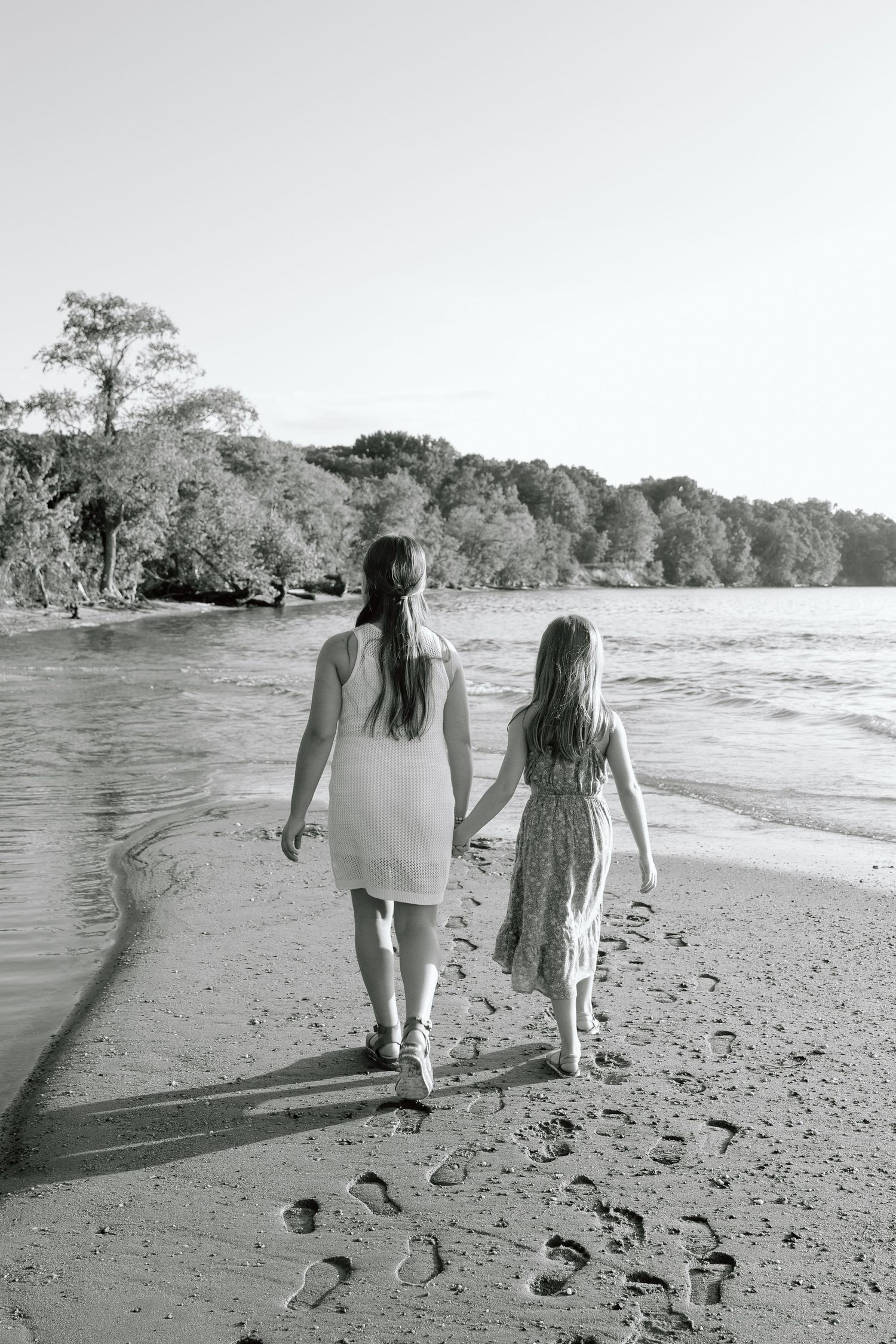 Siblings laughing together during a relaxed lifestyle photo shoot in Maryland