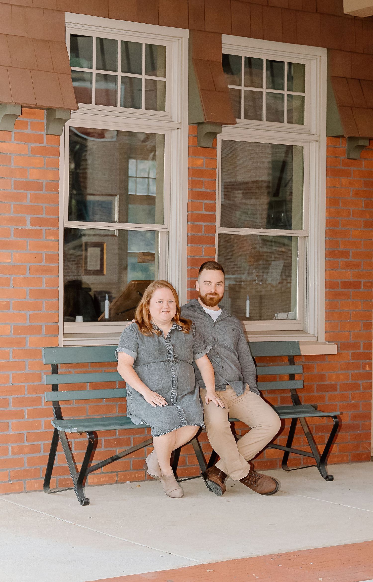 Progressive images of a couple sitting together on outdoor benches against a brick wall with white windows.
