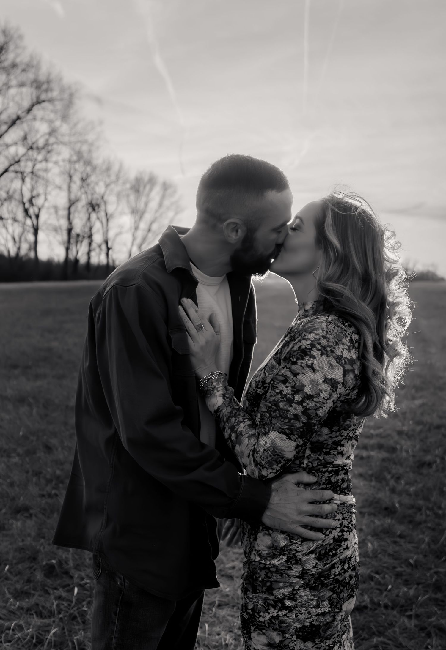 Candid family moment captured in the Maryland countryside during a golden-hour session
