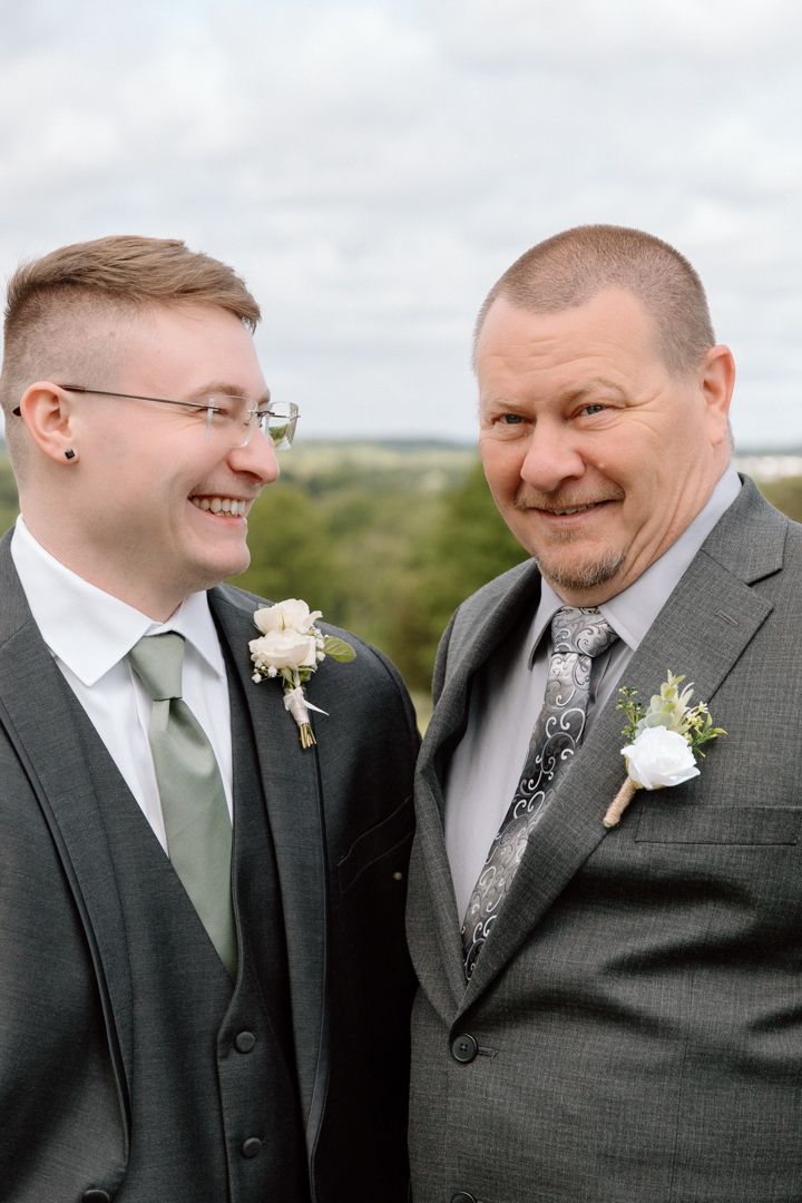 A series of candid moments showing laughter and joy between two men in grey suits with white boutonnieres.