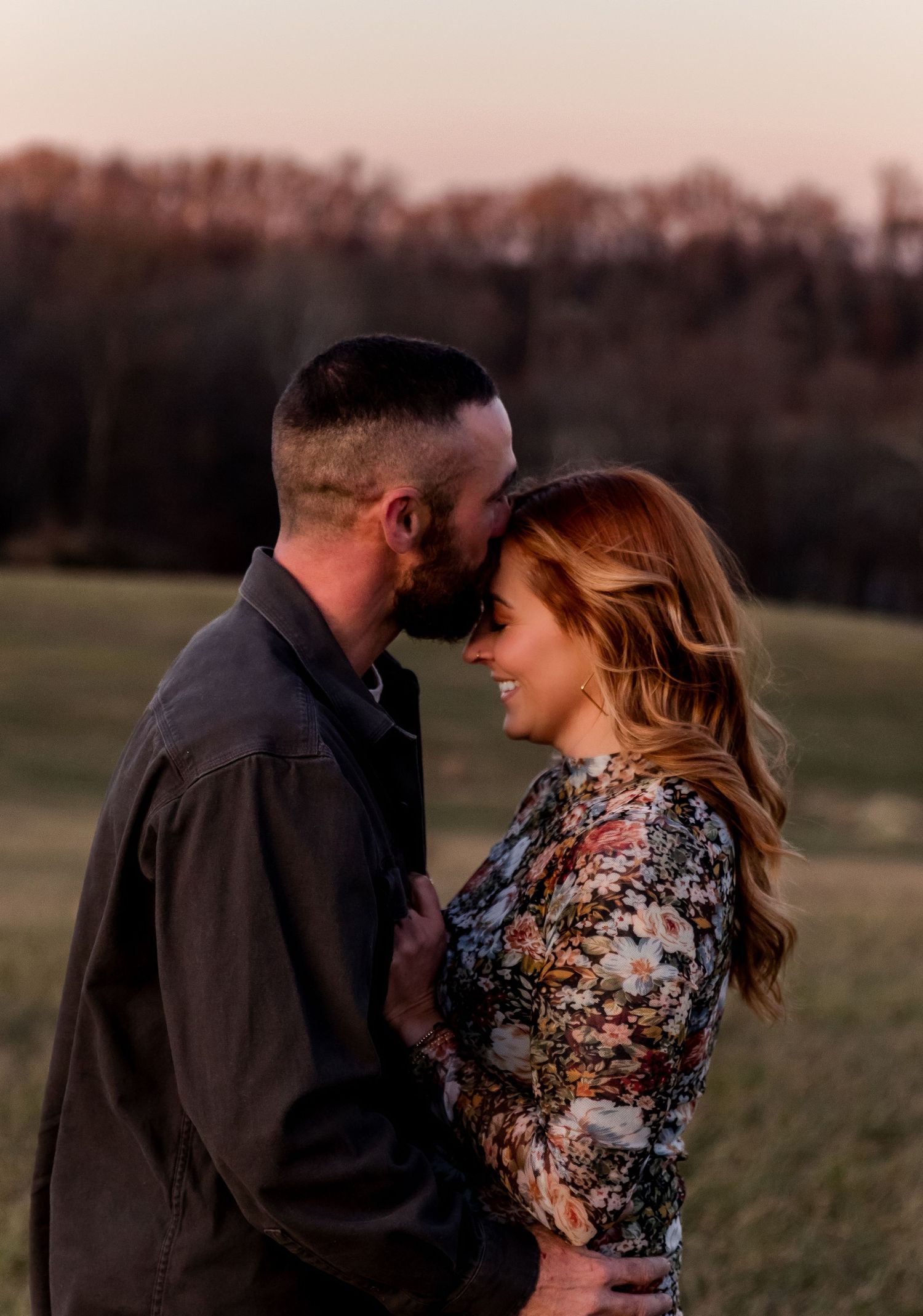 A romantic couple embraces in an outdoor field during golden hour, with multiple poses shown in a series of photos.